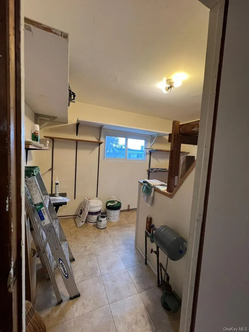 Below grade area featuring light tile patterned floors Below grade area featuring light tile patterned floors