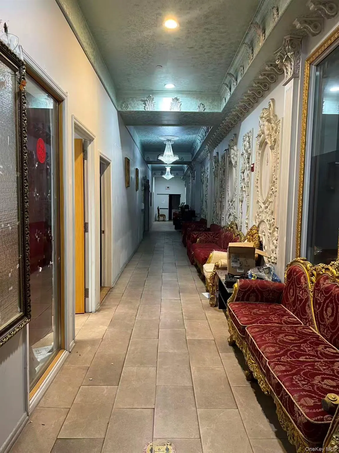 Hall featuring a textured ceiling Hall featuring a textured ceiling