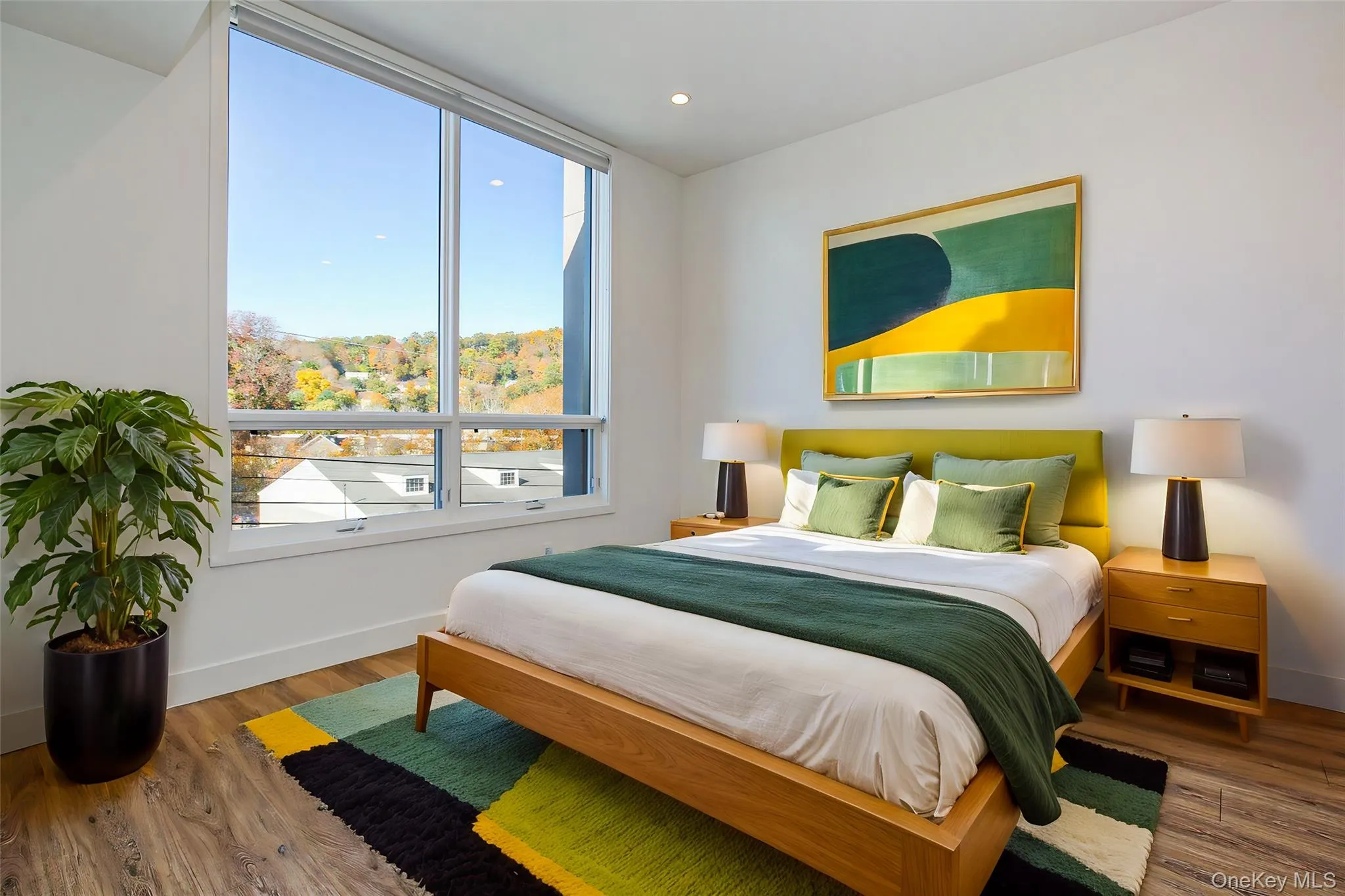 Bedroom featuring hardwood / wood-style floors, virtually staged Bedroom featuring hardwood / wood-style floors, virtually staged