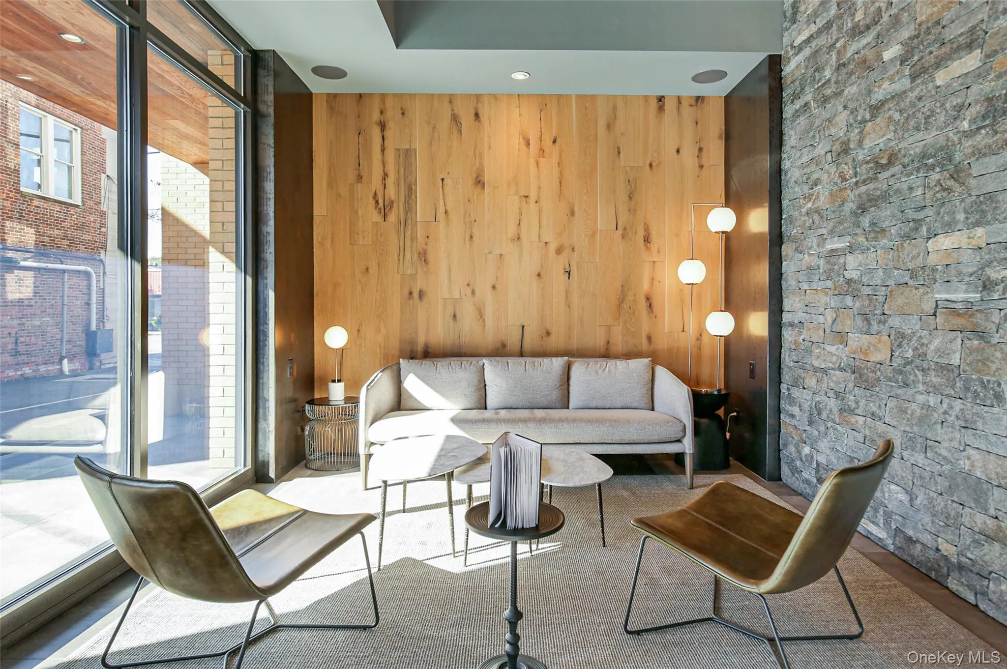 Living room featuring wooden walls Living room featuring wooden walls