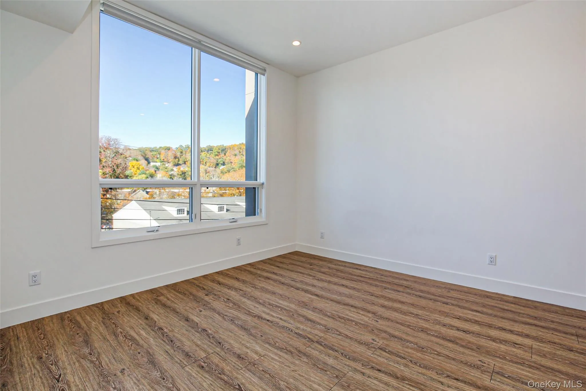 Unfurnished room with wood-type flooring Unfurnished room with wood-type flooring