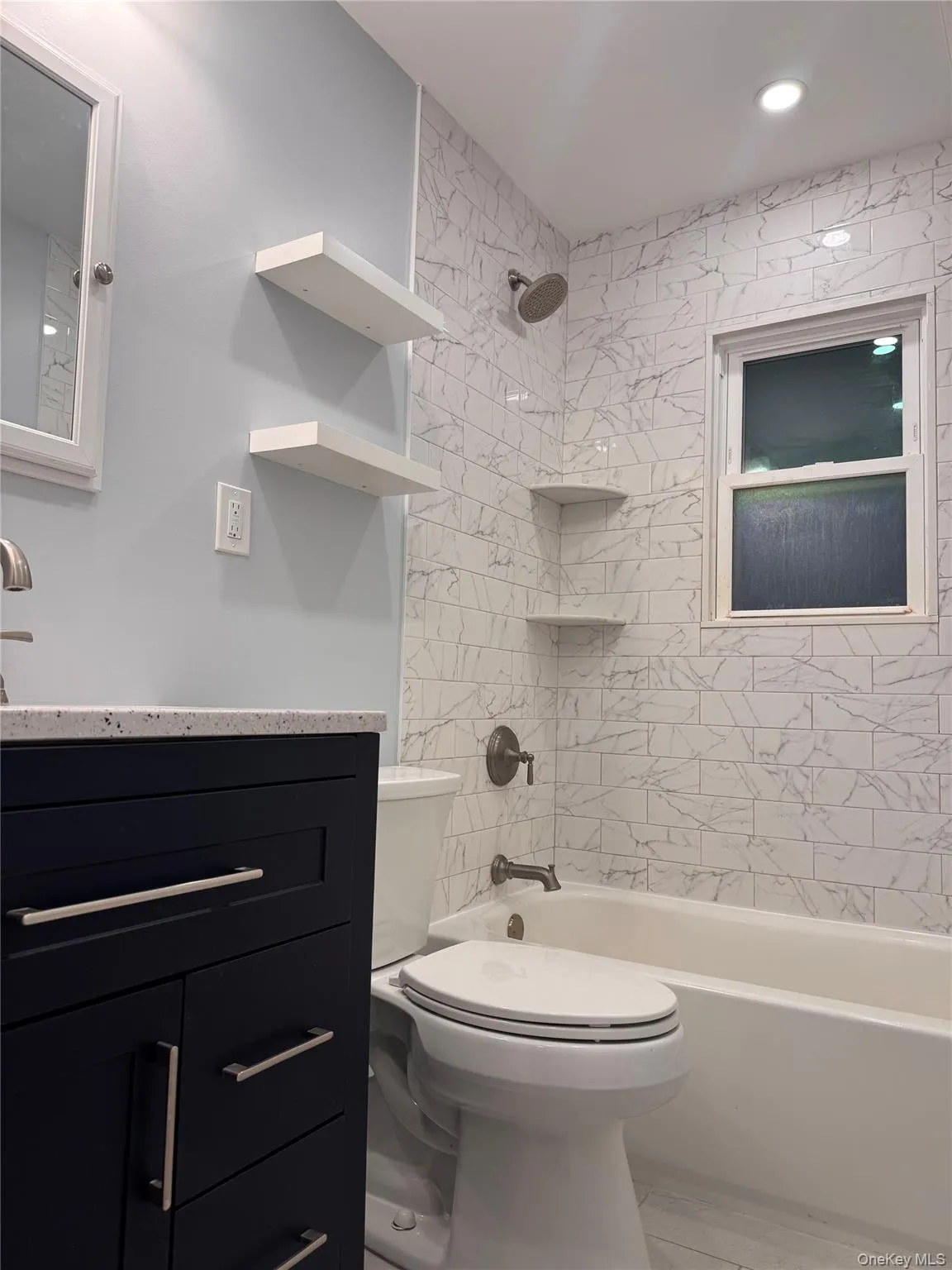 Full bath with vanity, shower / tub combination, and recessed lighting Full bath with vanity, shower / tub combination, and recessed lighting