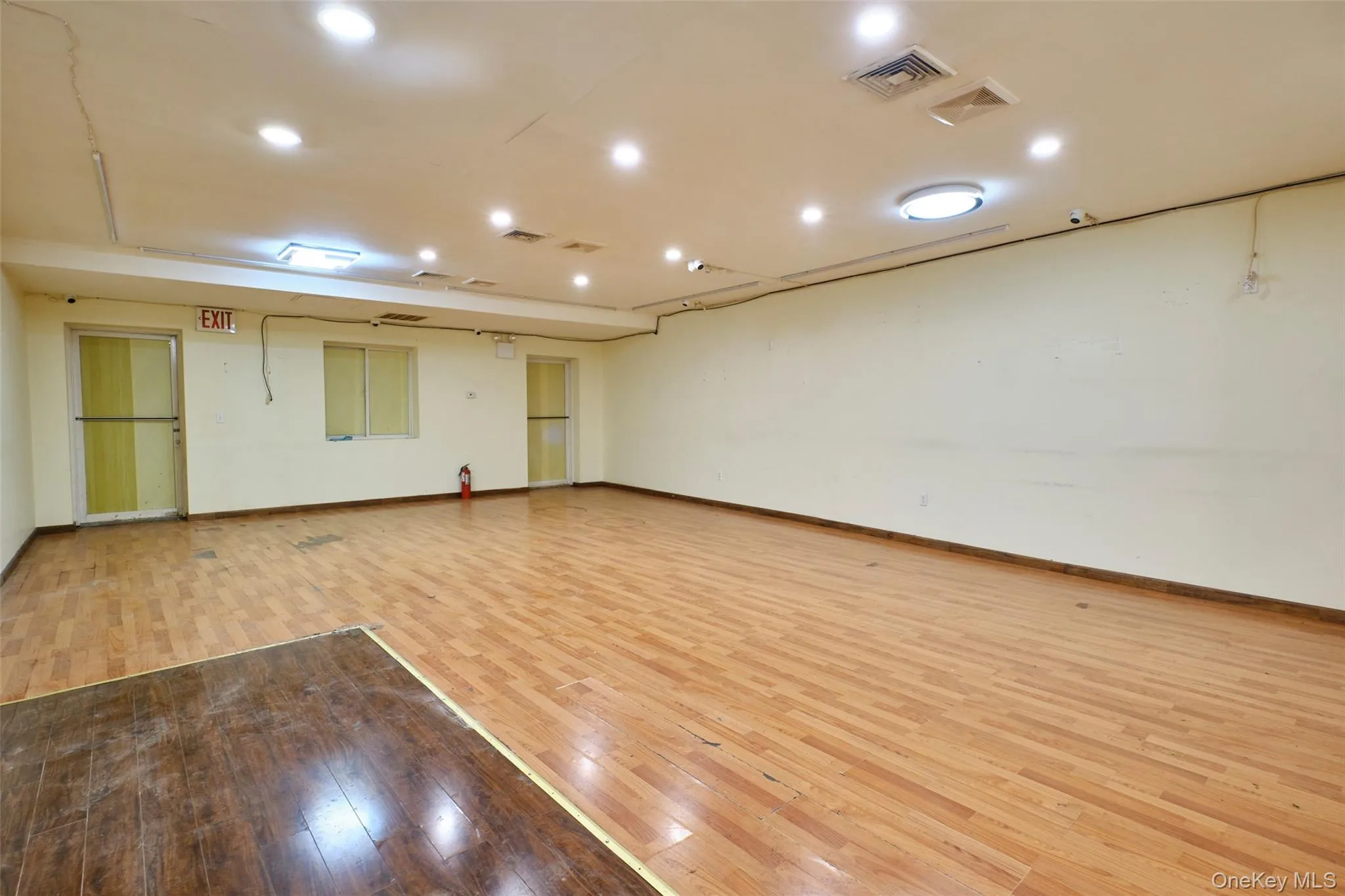 Spare room with light wood finished floors and recessed lighting Spare room with light wood finished floors and recessed lighting