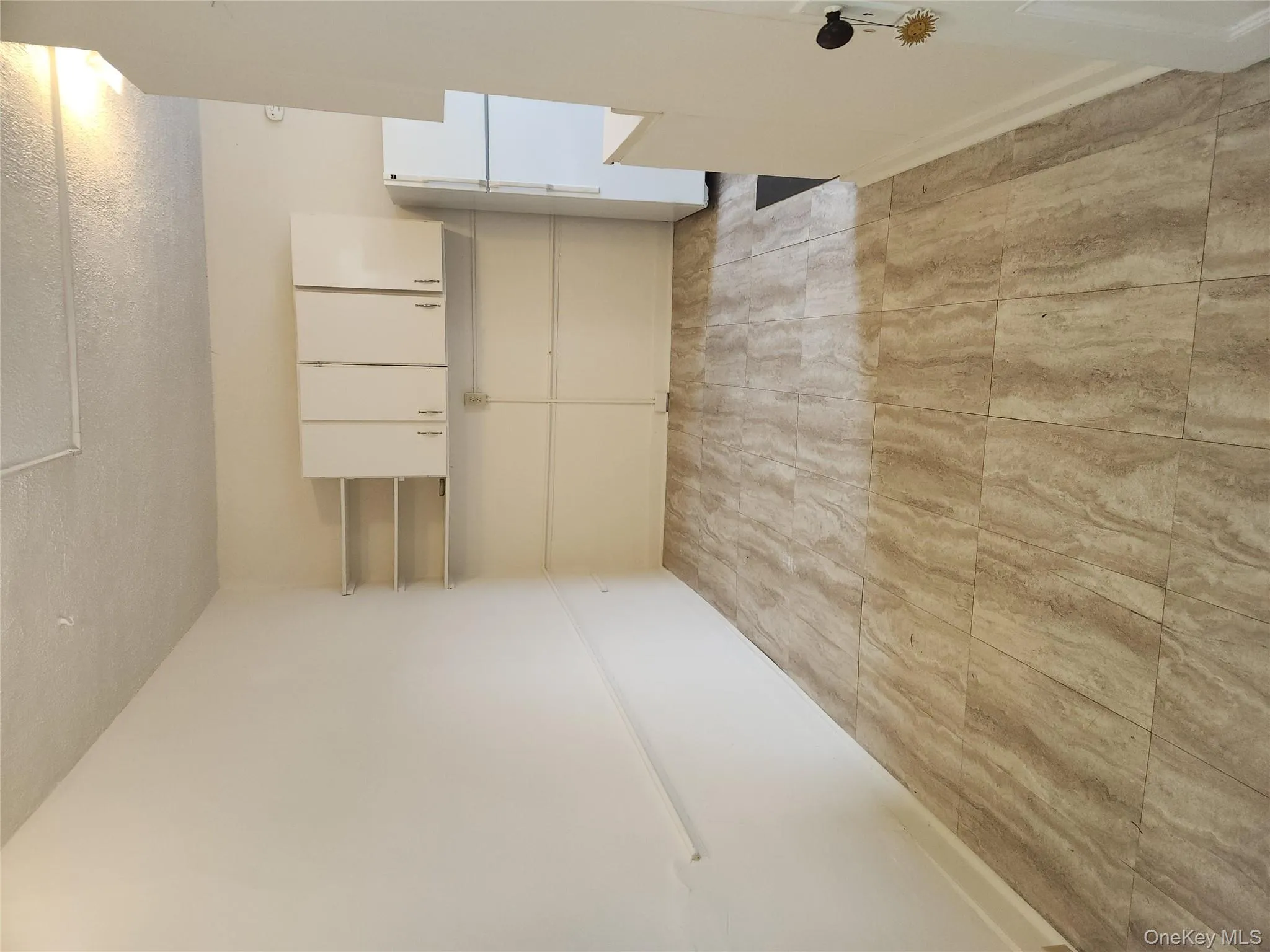 Unfurnished room with a textured ceiling Unfurnished room with a textured ceiling