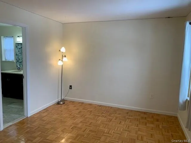 Unfurnished room with baseboards Unfurnished room with baseboards