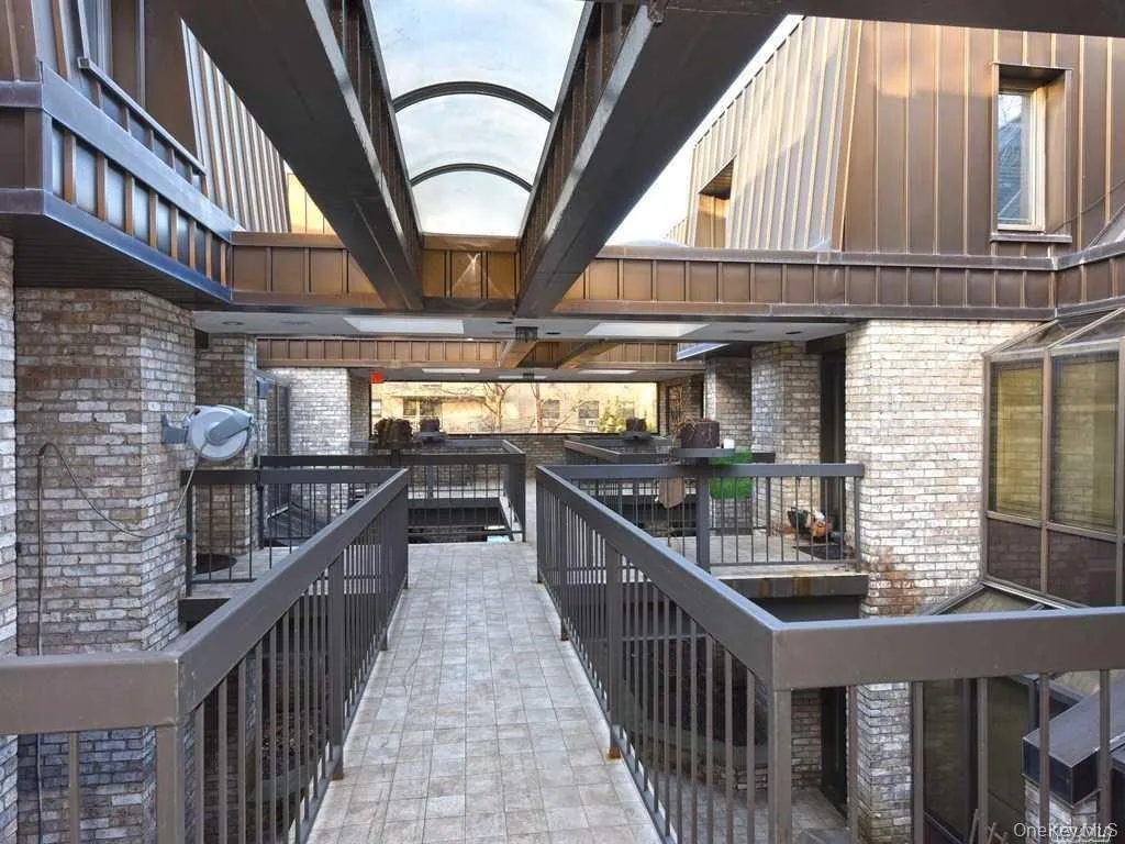 View of patio with a wooden deck View of patio with a wooden deck