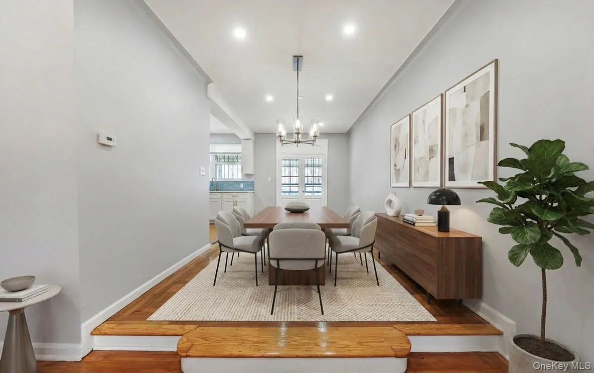 Dining area featuring recessed lighting, wood finished floors, and a chandelier Dining area featuring recessed lighting, wood finished floors, and a chandelier