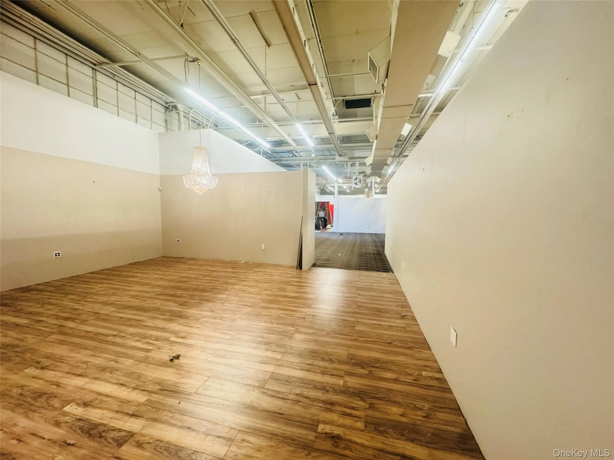 Unfurnished room featuring wood finished floors Unfurnished room featuring wood finished floors