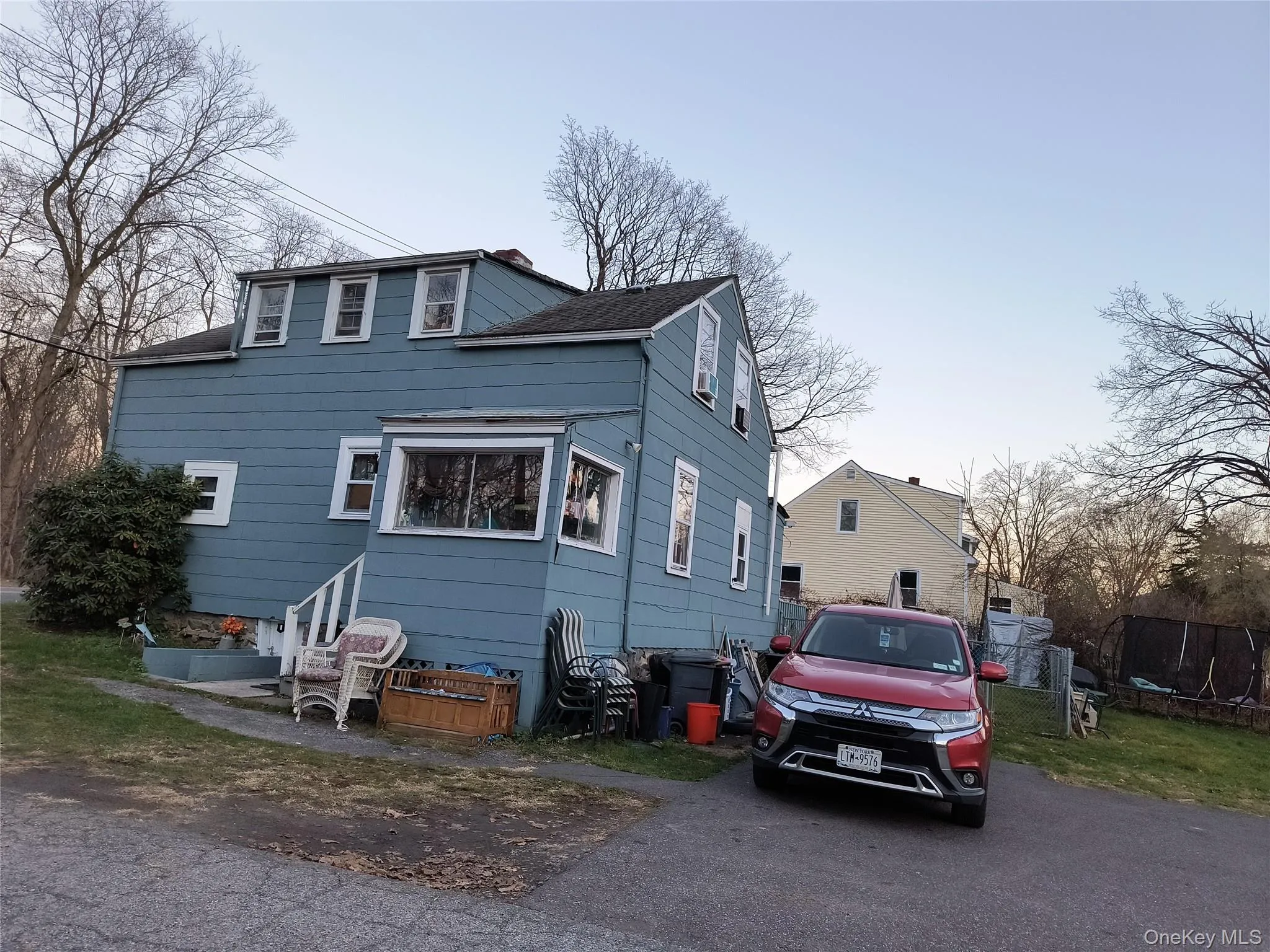 Traditional-style house with a parking area Traditional-style house with a parking area