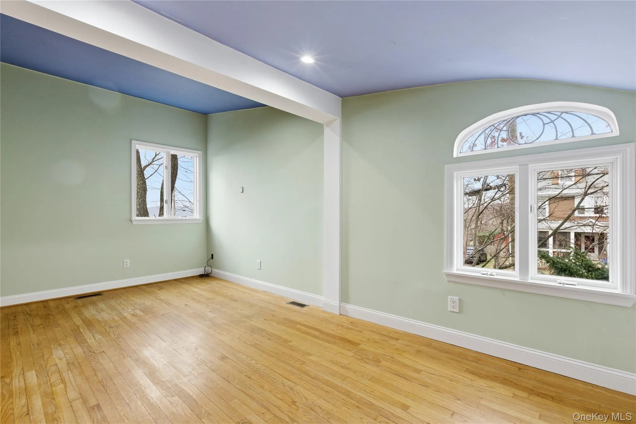Spare room featuring baseboards and light wood-type flooring Spare room featuring baseboards and light wood-type flooring
