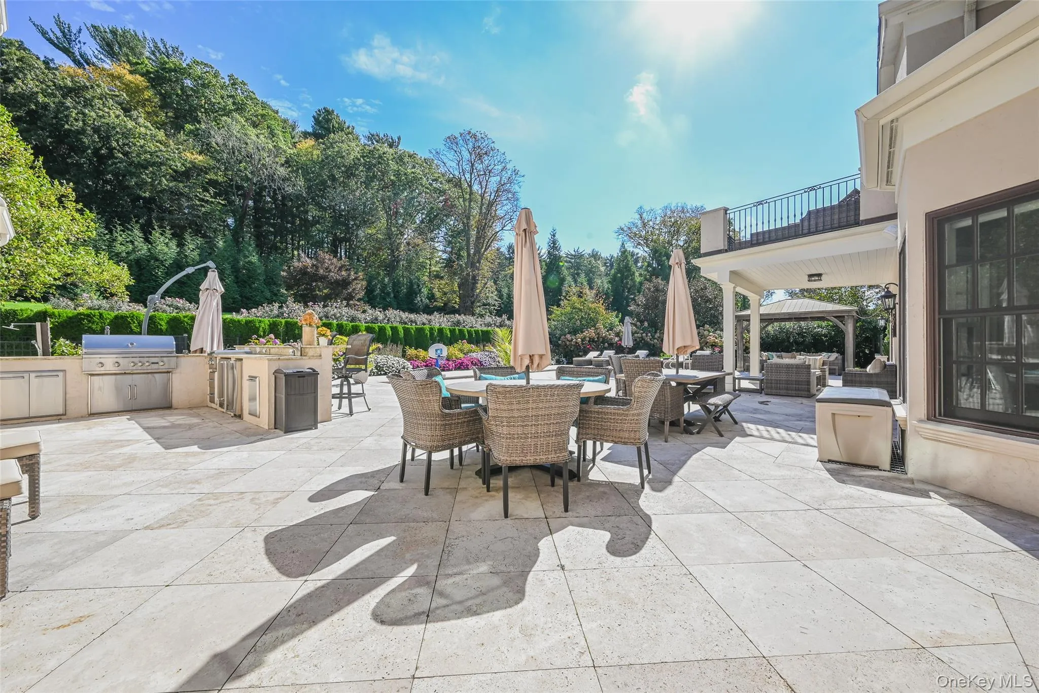 Patio / terrace with an outdoor kitchen, outdoor dining area, and a patio Patio / terrace with an outdoor kitchen, outdoor dining area, and a patio