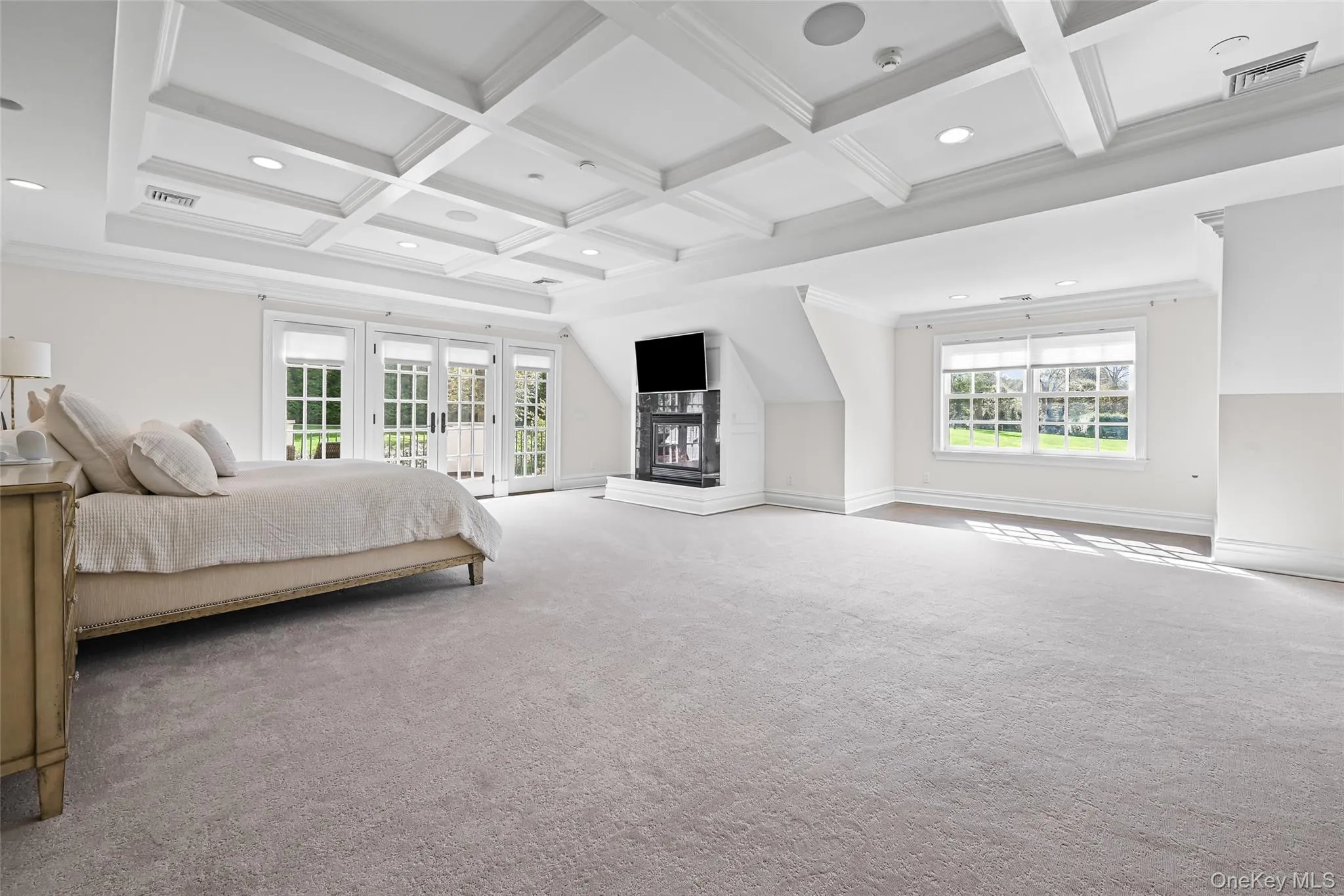 Bedroom featuring crown molding, coffered ceiling, recessed lighting, multiple windows, and access to outside Bedroom featuring crown molding, coffered ceiling, recessed lighting, multiple windows, and access to outside