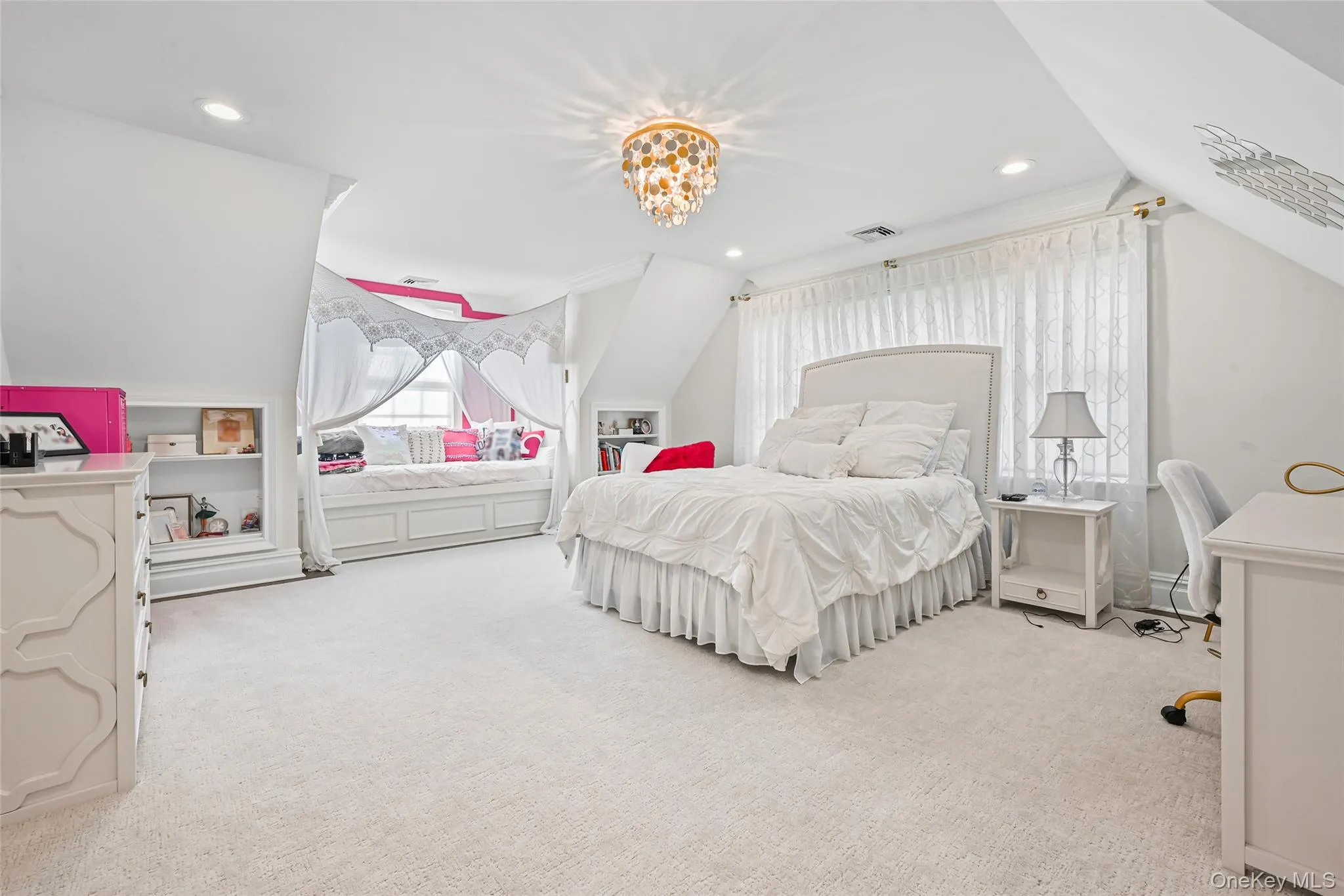 Bedroom featuring vaulted ceiling, light carpet, a chandelier, and recessed lighting Bedroom featuring vaulted ceiling, light carpet, a chandelier, and recessed lighting