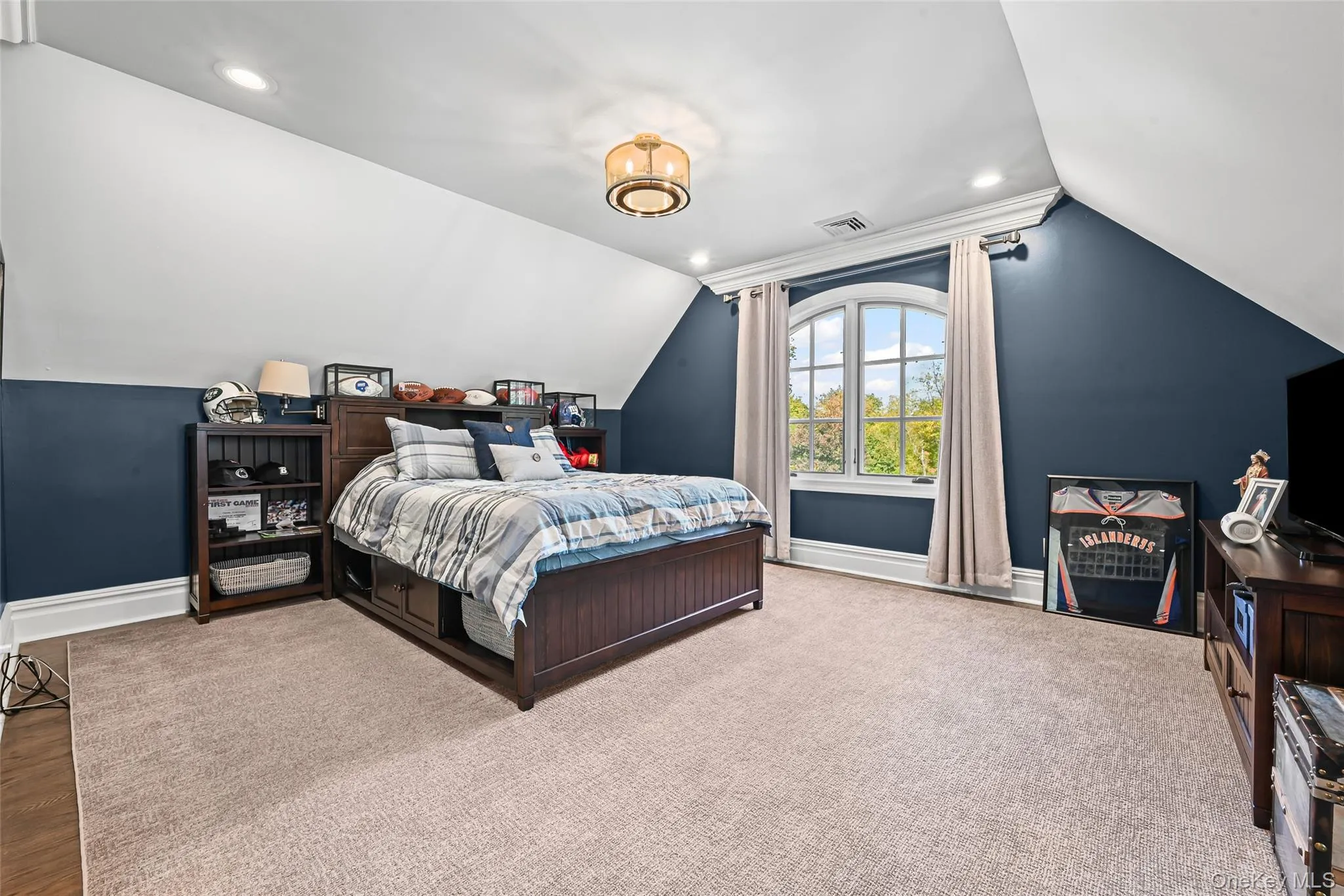 Bedroom with vaulted ceiling and recessed lighting Bedroom with vaulted ceiling and recessed lighting