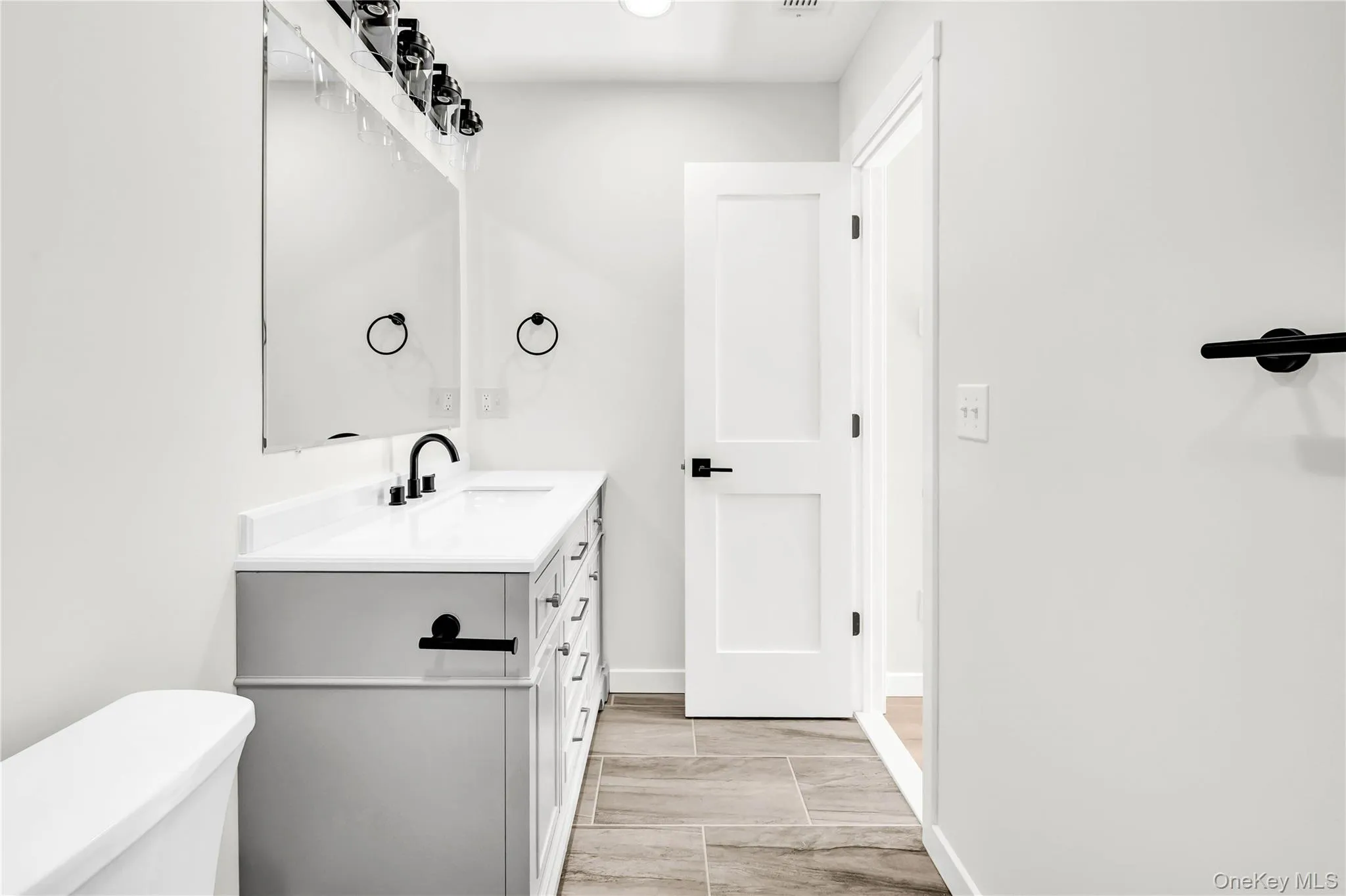 Bathroom featuring vanity and recessed lighting Bathroom featuring vanity and recessed lighting