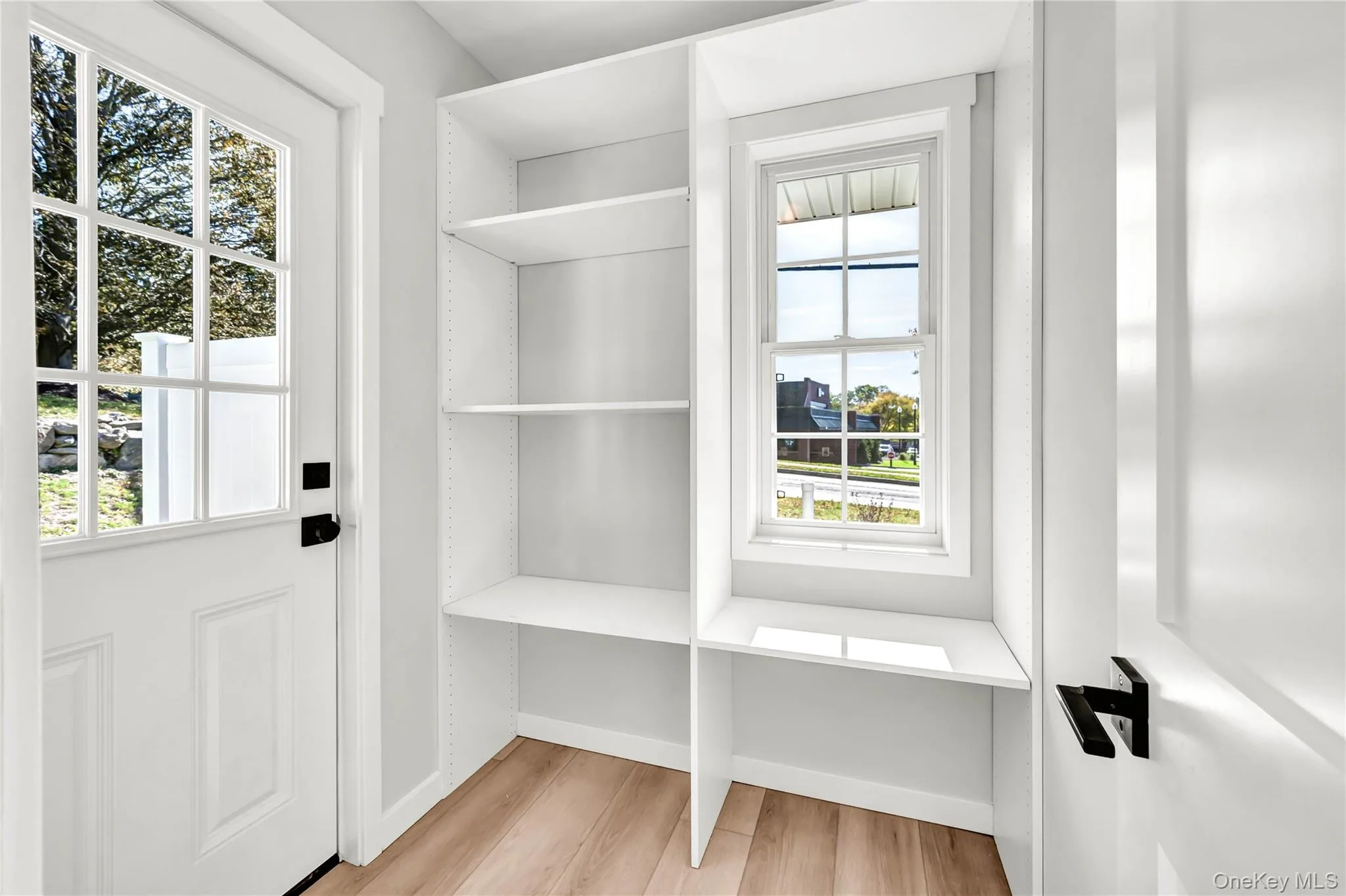 Mudroom featuring light wood finished floors and baseboards Mudroom featuring light wood finished floors and baseboards