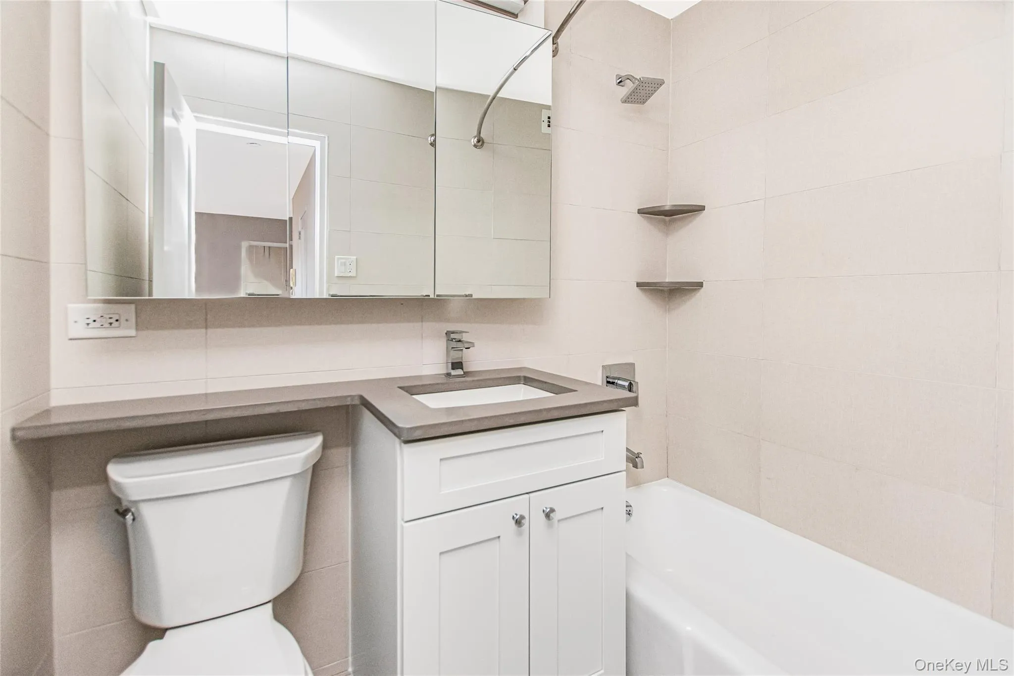 Bathroom with bathing tub / shower combination and vanity Bathroom with bathing tub / shower combination and vanity