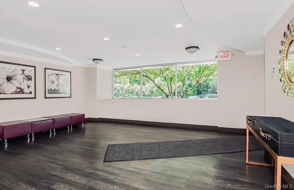 Building lobby featuring crown molding and recessed lighting Building lobby featuring crown molding and recessed lighting