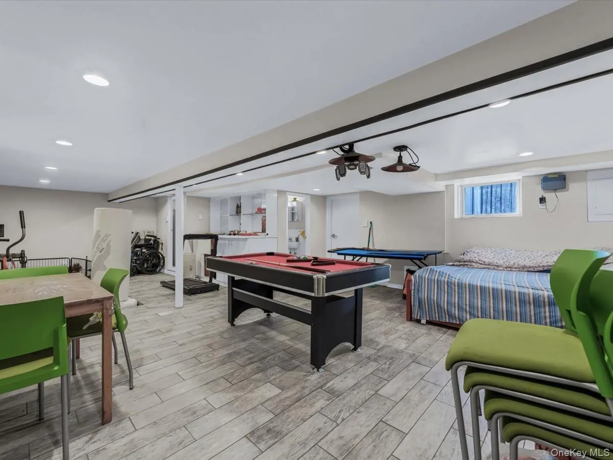 Game room featuring wood finish floors, recessed lighting, and pool table Game room featuring wood finish floors, recessed lighting, and pool table
