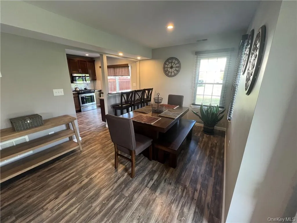 Dining room with dark hardwood / wood-style floors Dining room with dark hardwood / wood-style floors