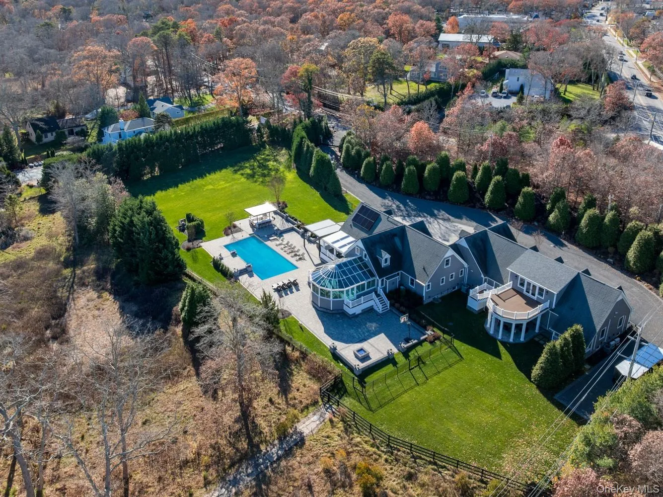 Bird's eye view of a pool area and a tree filled landscape Bird's eye view of a pool area and a tree filled landscape