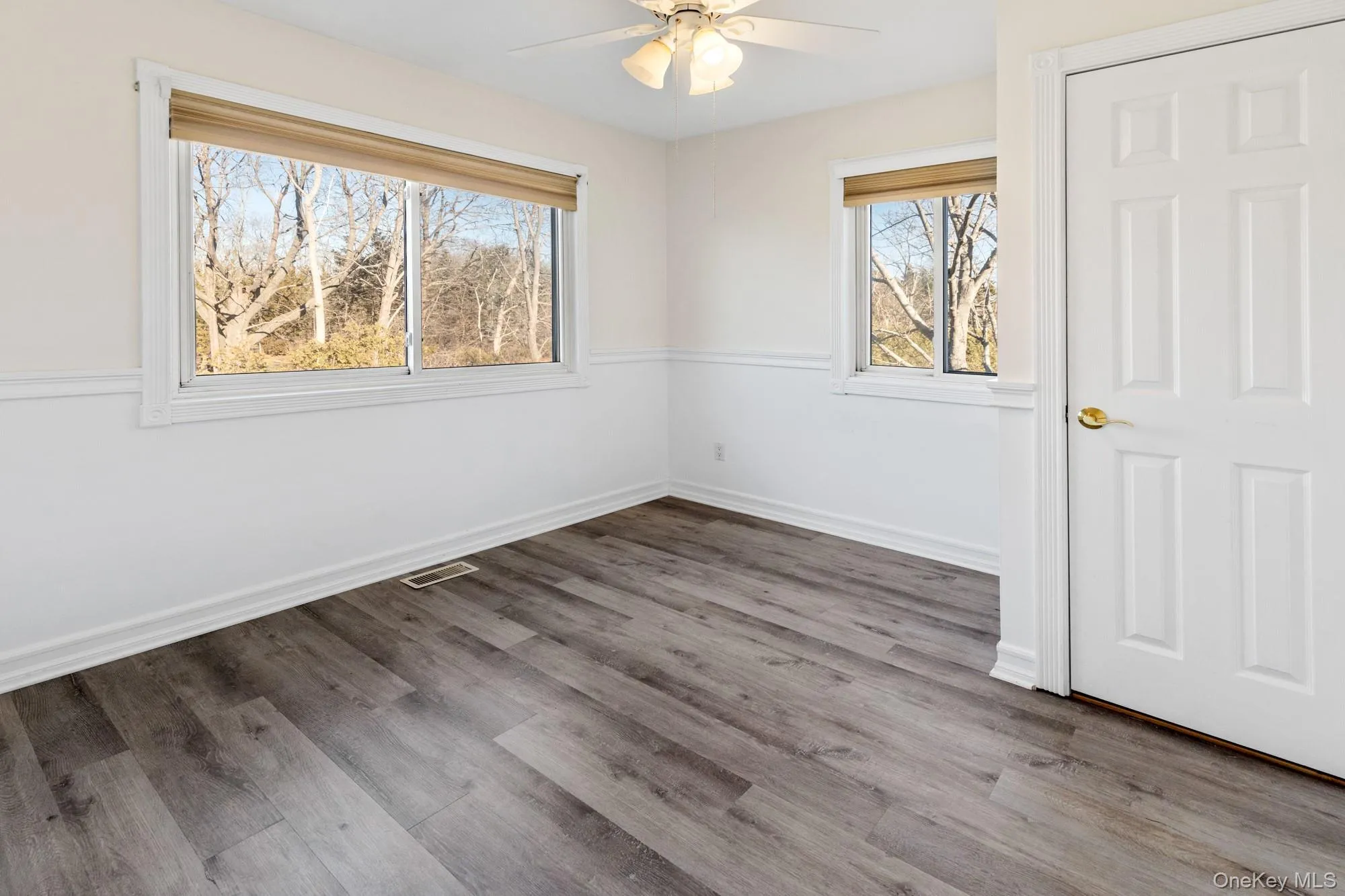 Unfurnished 2nd bedroom featuring light wood-style floors and a ceiling fan Unfurnished 2nd bedroom featuring light wood-style floors and a ceiling fan