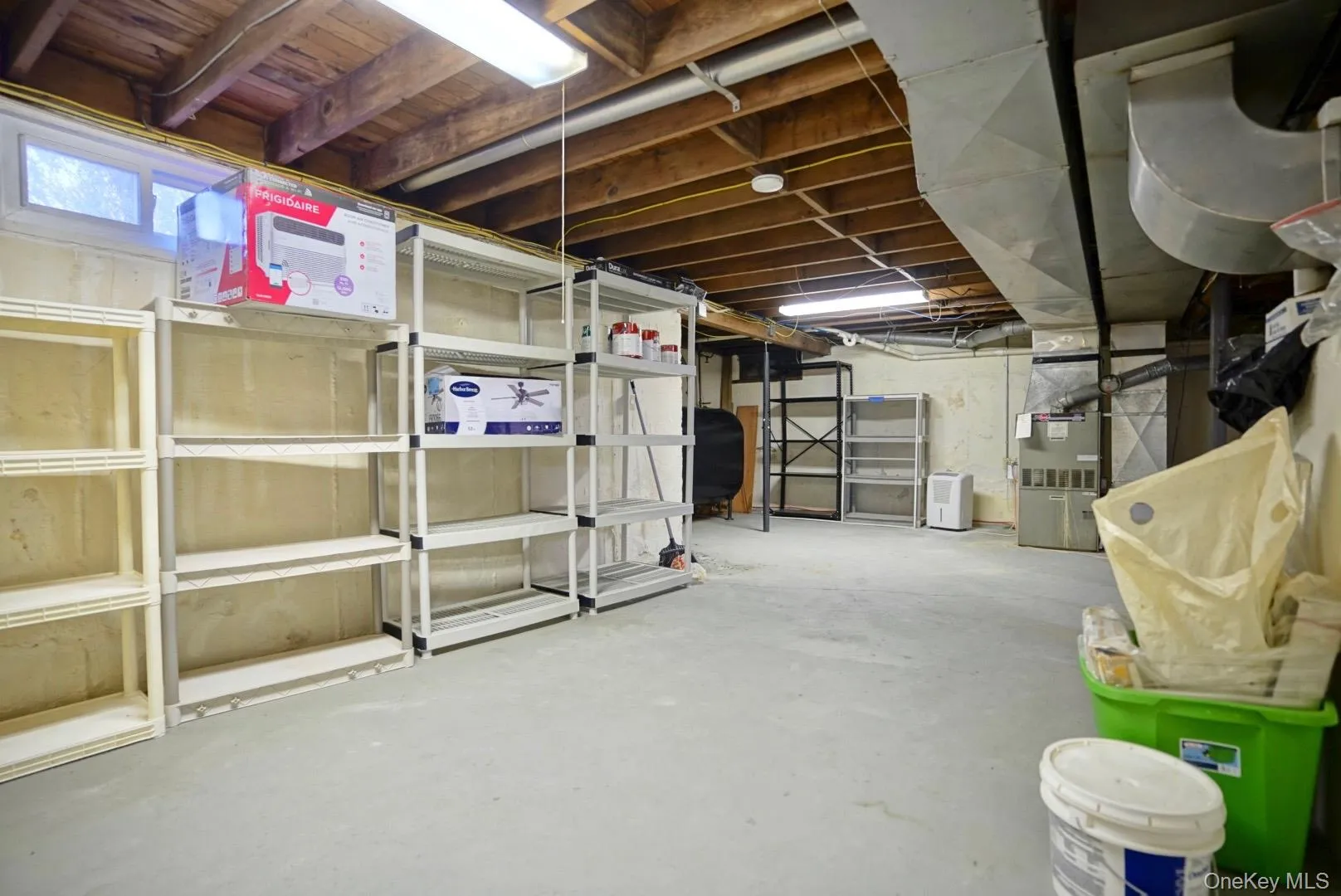 Basement featuring heating unit Basement featuring heating unit