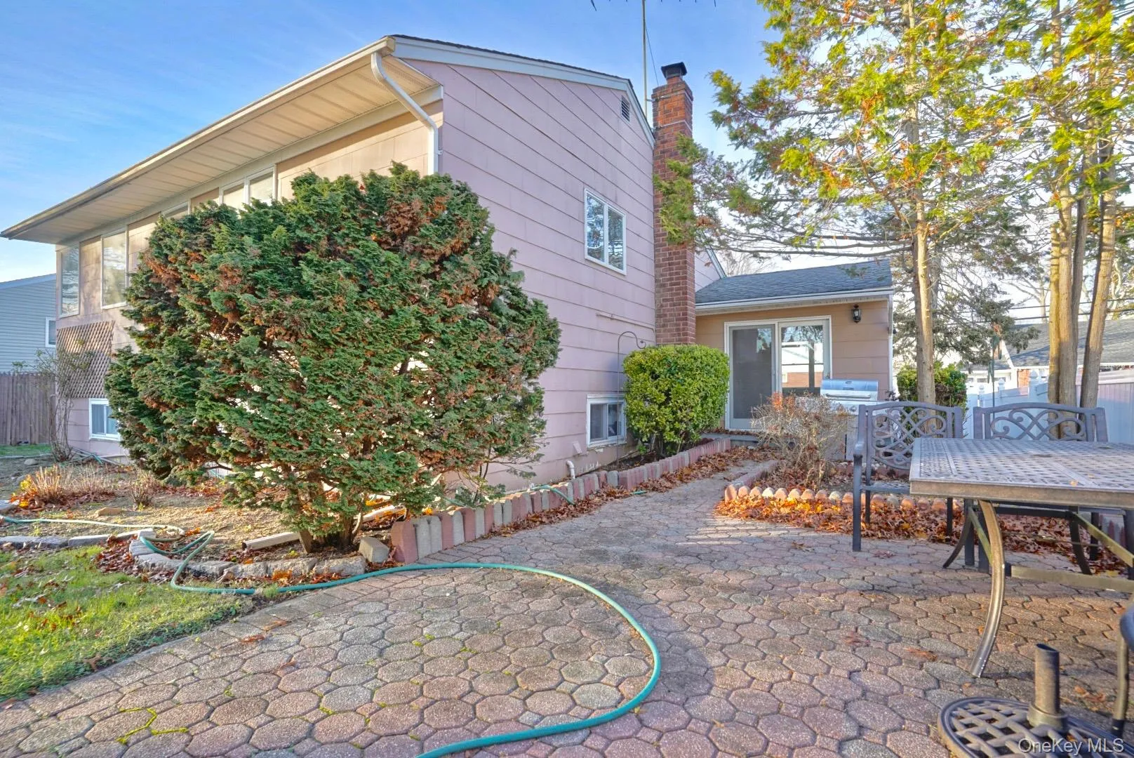 View of patio featuring outdoor dining space and a grill View of patio featuring outdoor dining space and a grill