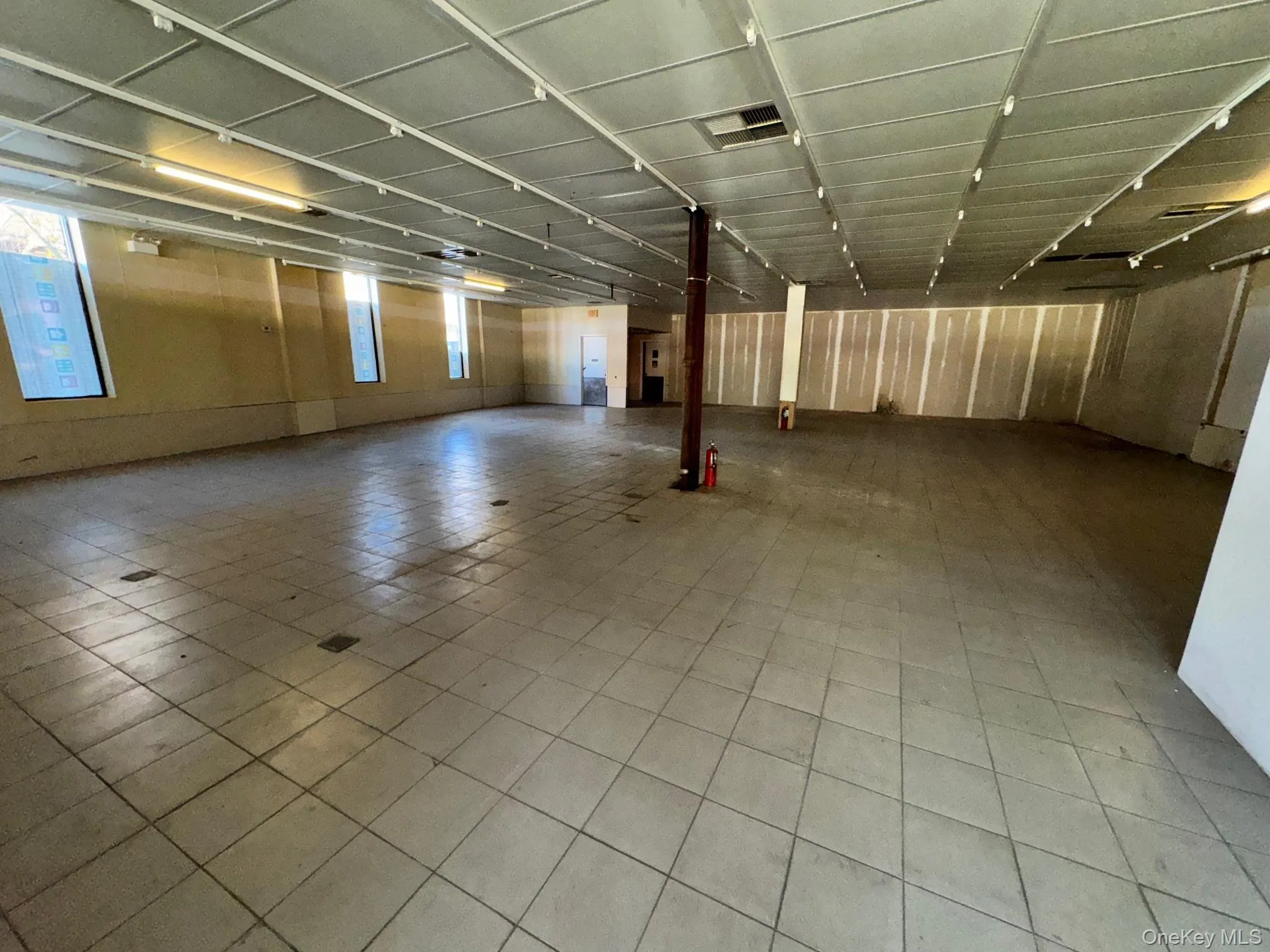 Below grade area with tile patterned flooring Below grade area with tile patterned flooring