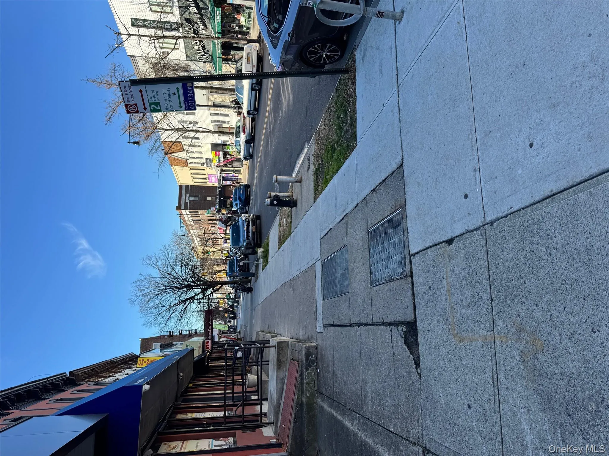 View of asphalt street featuring sidewalks, curbs, and street lighting View of asphalt street featuring sidewalks, curbs, and street lighting