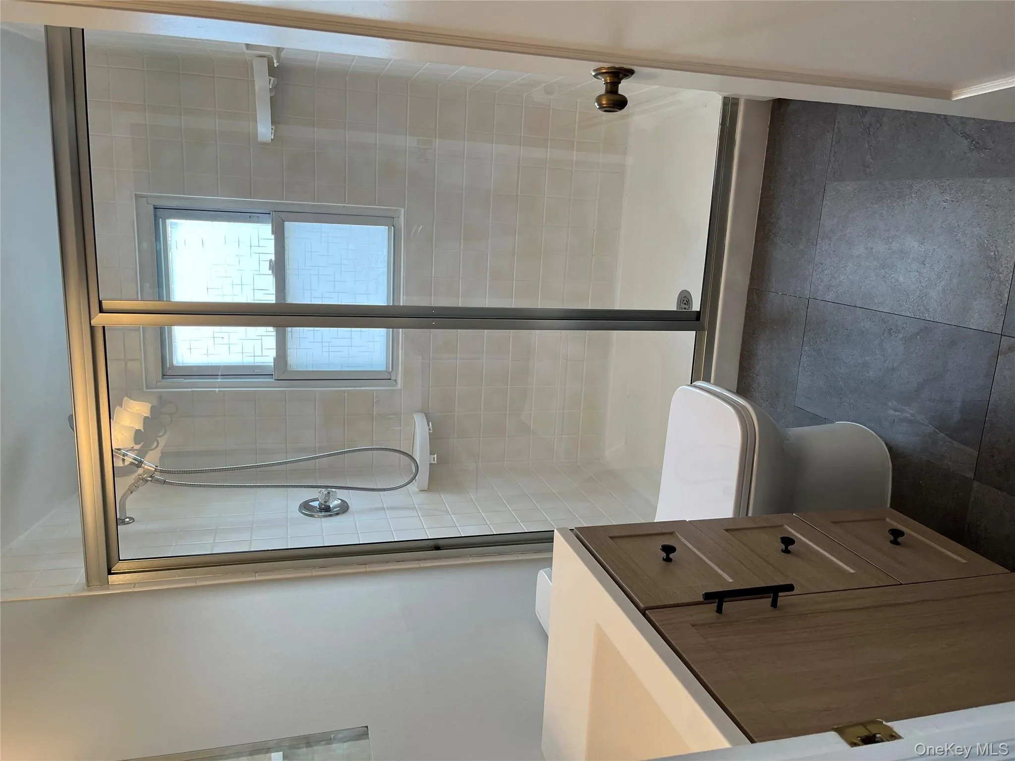 Second floor bathroom featuring new vanity and new toilet and a shower stall Second floor bathroom featuring new vanity and new toilet and a shower stall