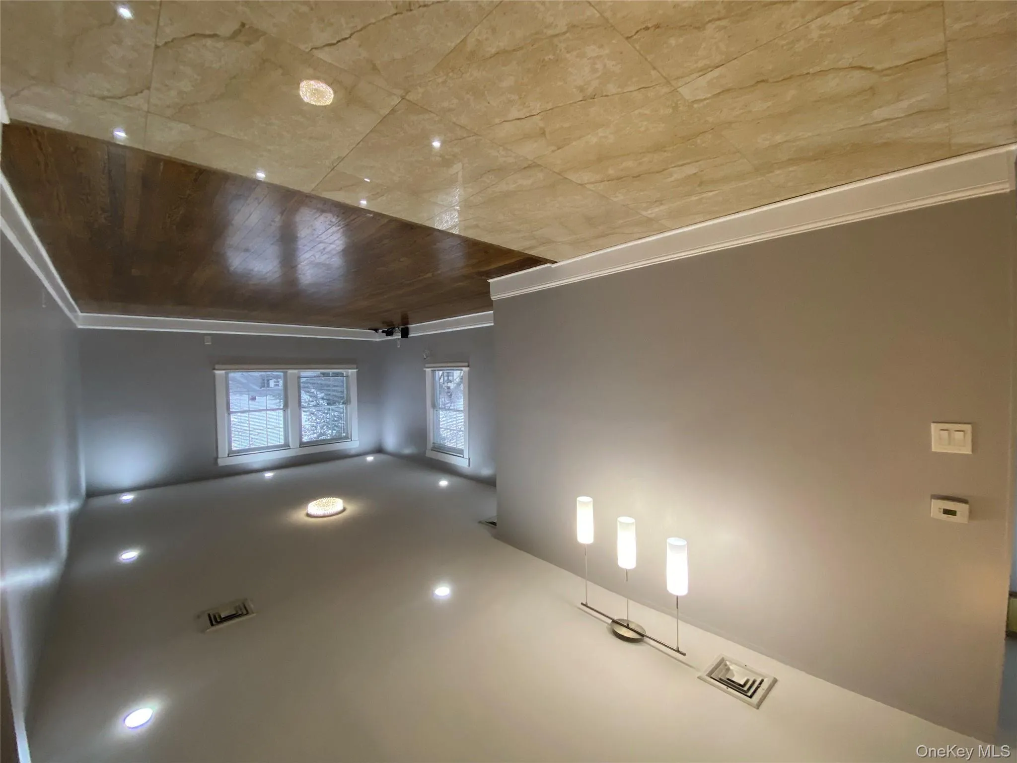 Unfurnished room with light wood-style flooring and recessed lighting Unfurnished room with light wood-style flooring and recessed lighting