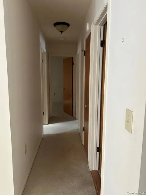 Corridor featuring carpet Corridor featuring carpet