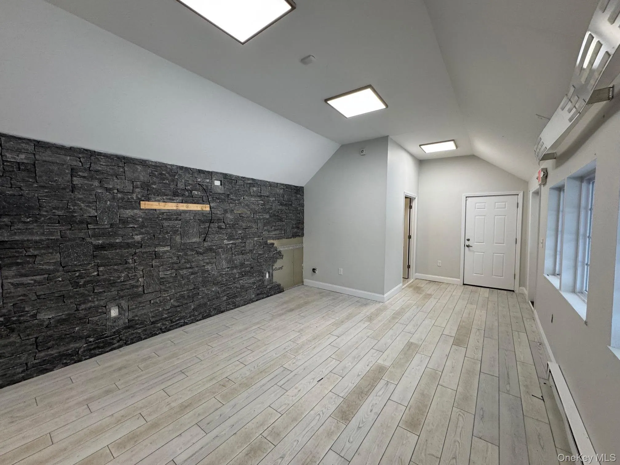 Interior view of the space with vaulted ceilings and decorative culture stone wall... Interior view of the space with vaulted ceilings and decorative culture stone wall...