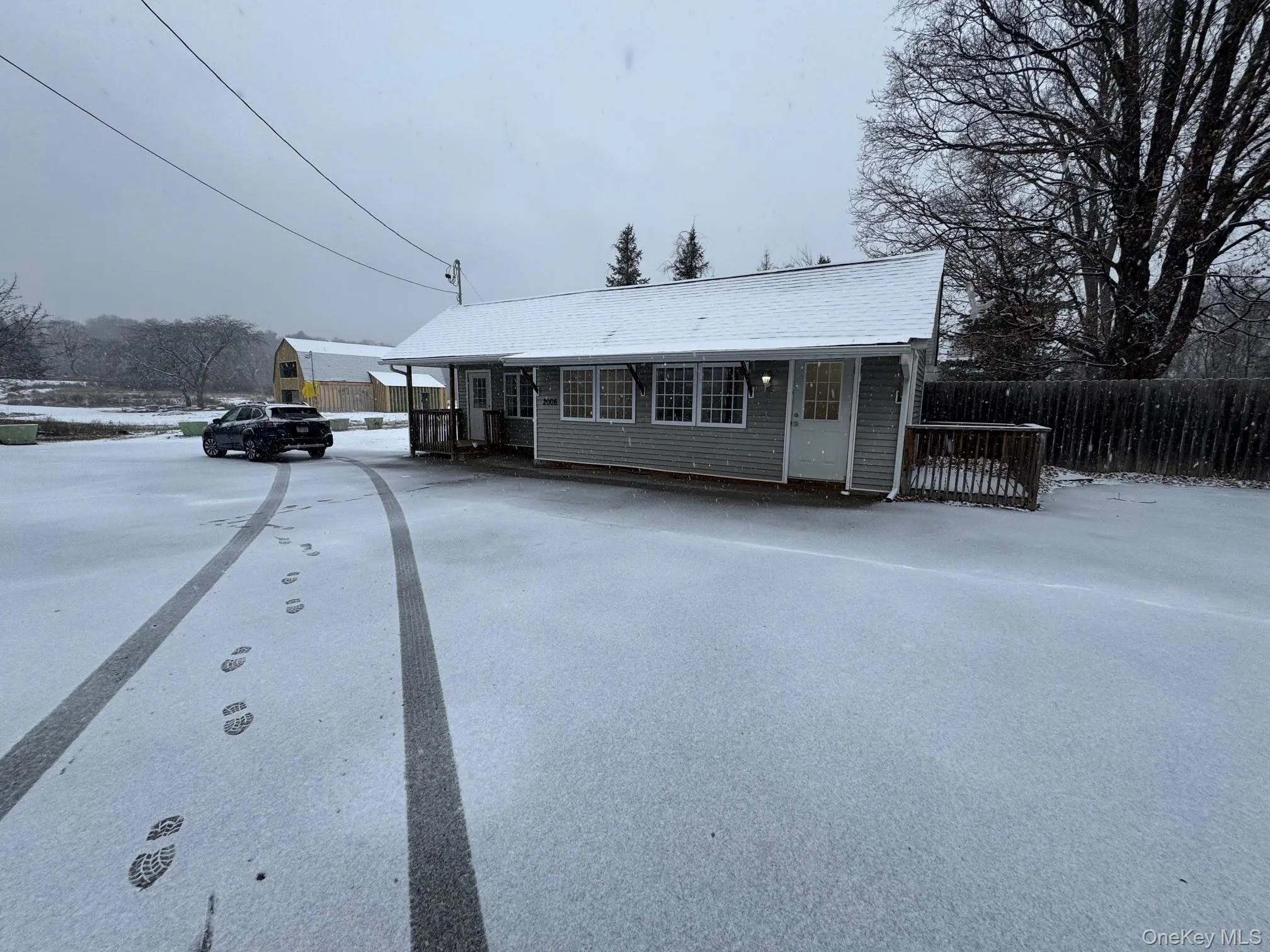 View of front of the building with parking area... View of front of the building with parking area...