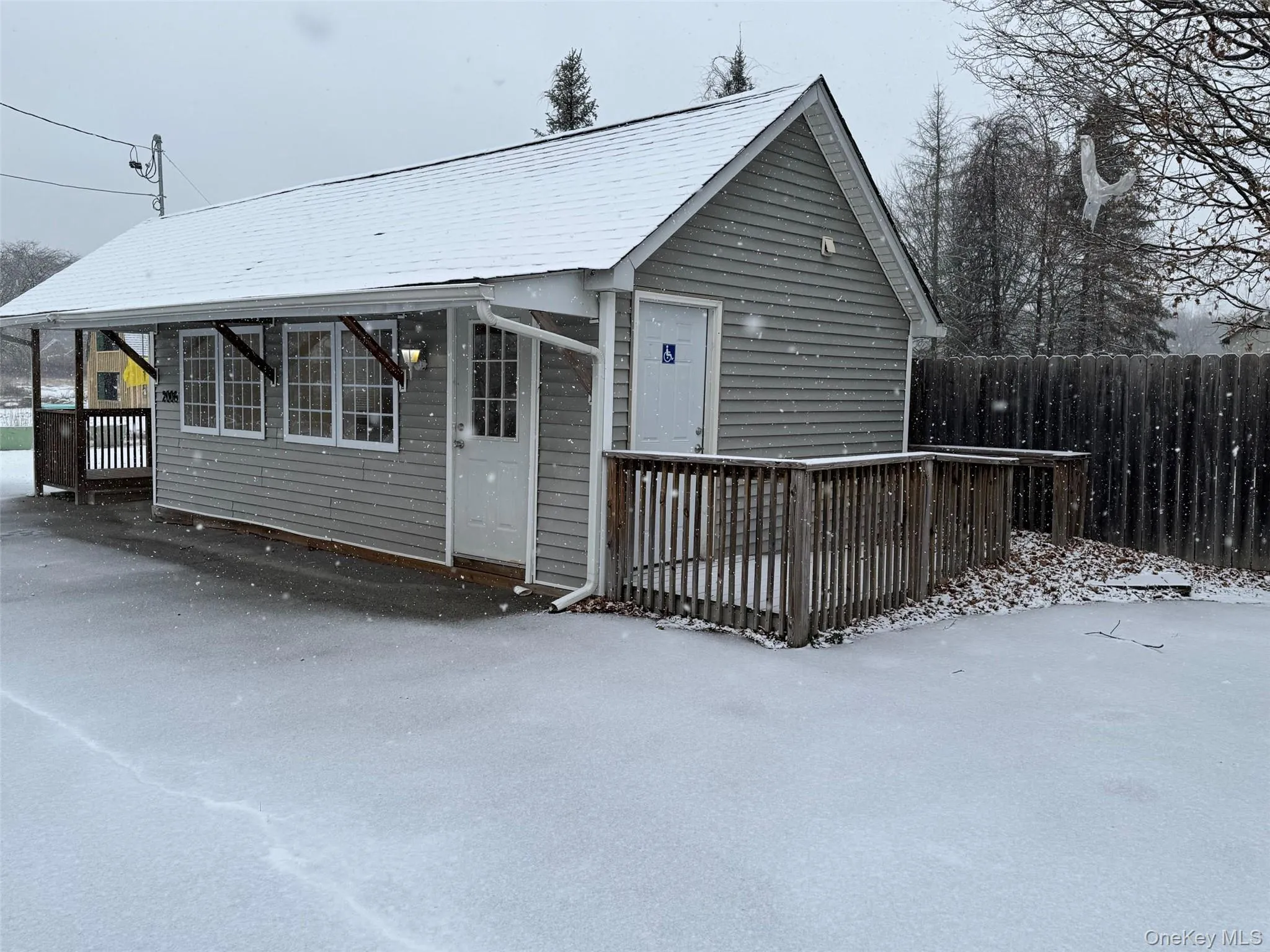 View of front and side entrance with ramp access. View of front and side entrance with ramp access.