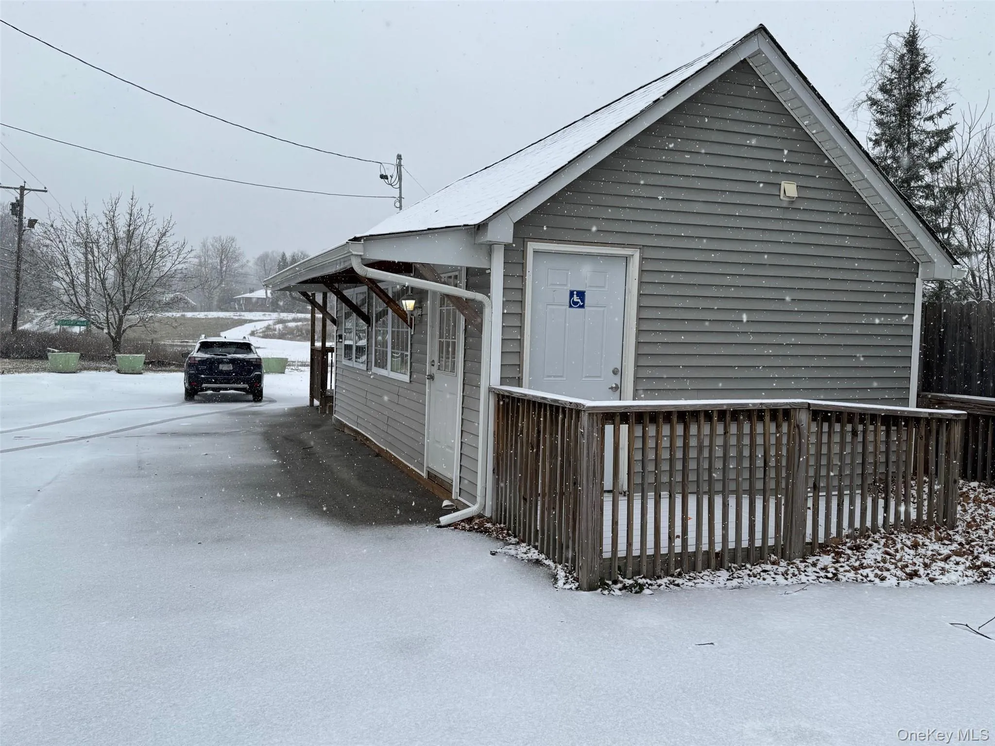 View of side ramp access to the building. View of side ramp access to the building.