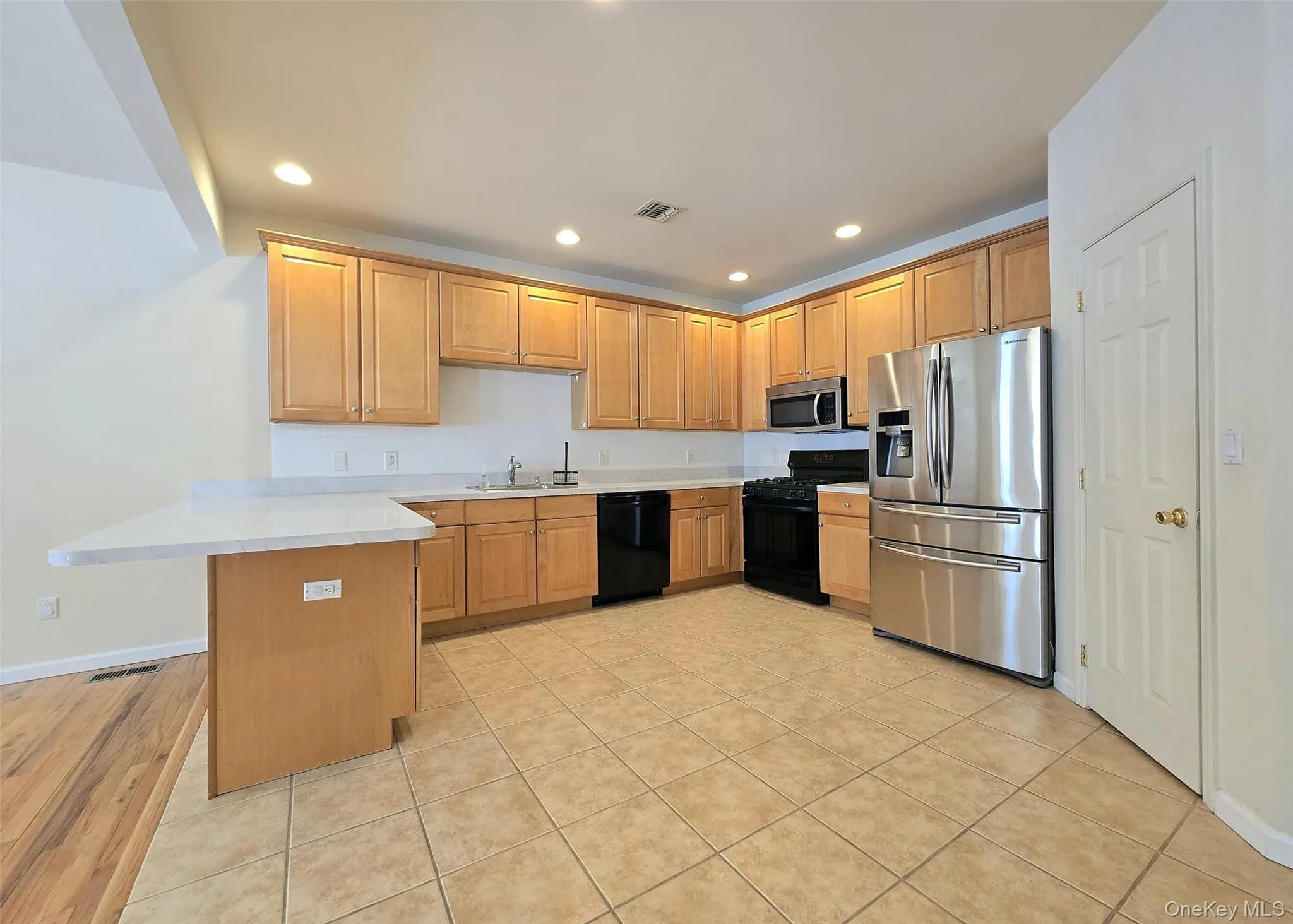 Large Eat In Kitchen With Tile Flooring, Plenty Of Cabinets, & Walk-In Pantry Large Eat In Kitchen With Tile Flooring, Plenty Of Cabinets, & Walk-In Pantry
