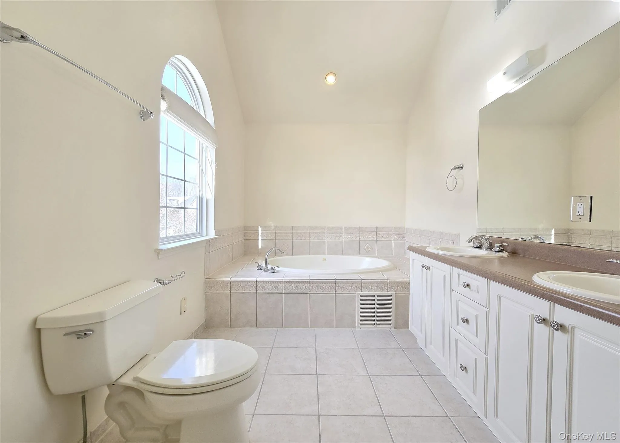 Private Bath In The Primary Bedrm With Tile, Deep Soaking Tub, & Half Moon Window Private Bath In The Primary Bedrm With Tile, Deep Soaking Tub, & Half Moon Window