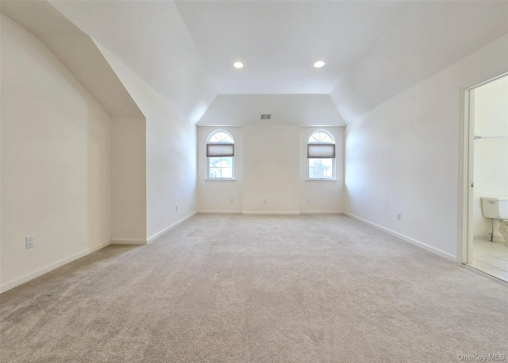 Primary Bedrm Ensuite With 2 Walk-In Closets, Vaulted Ceiling, & Half Moon Windows Primary Bedrm Ensuite With 2 Walk-In Closets, Vaulted Ceiling, & Half Moon Windows