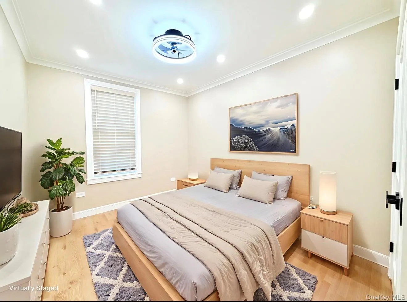 Bedroom featuring light wood-type flooring, ornamental molding, and recessed lighting Bedroom featuring light wood-type flooring, ornamental molding, and recessed lighting