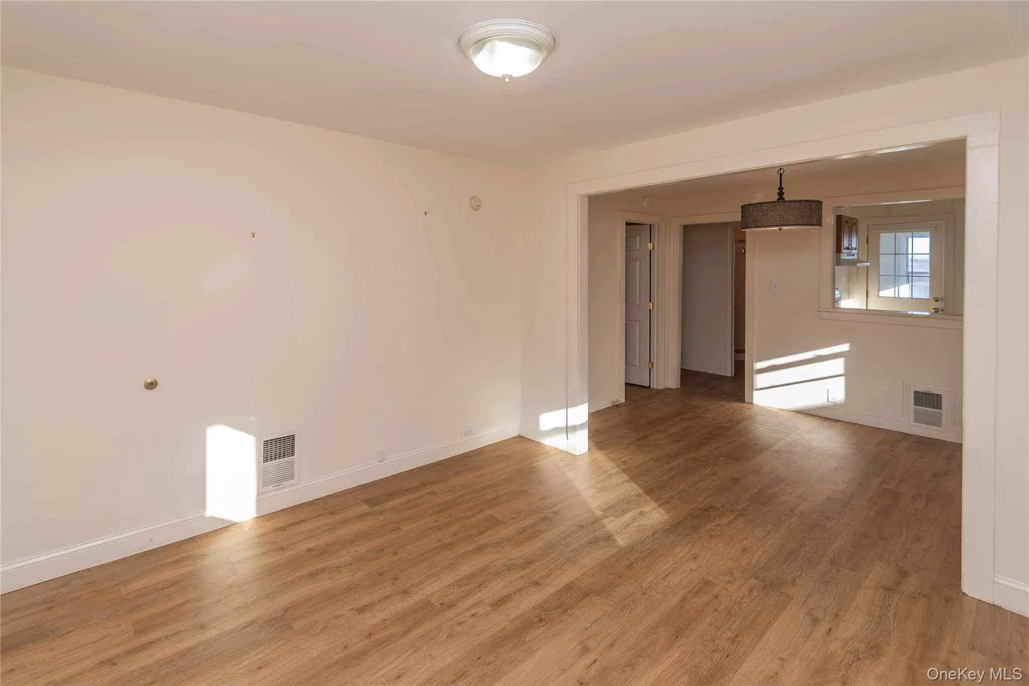 Unfurnished room with light wood-type flooring Unfurnished room with light wood-type flooring