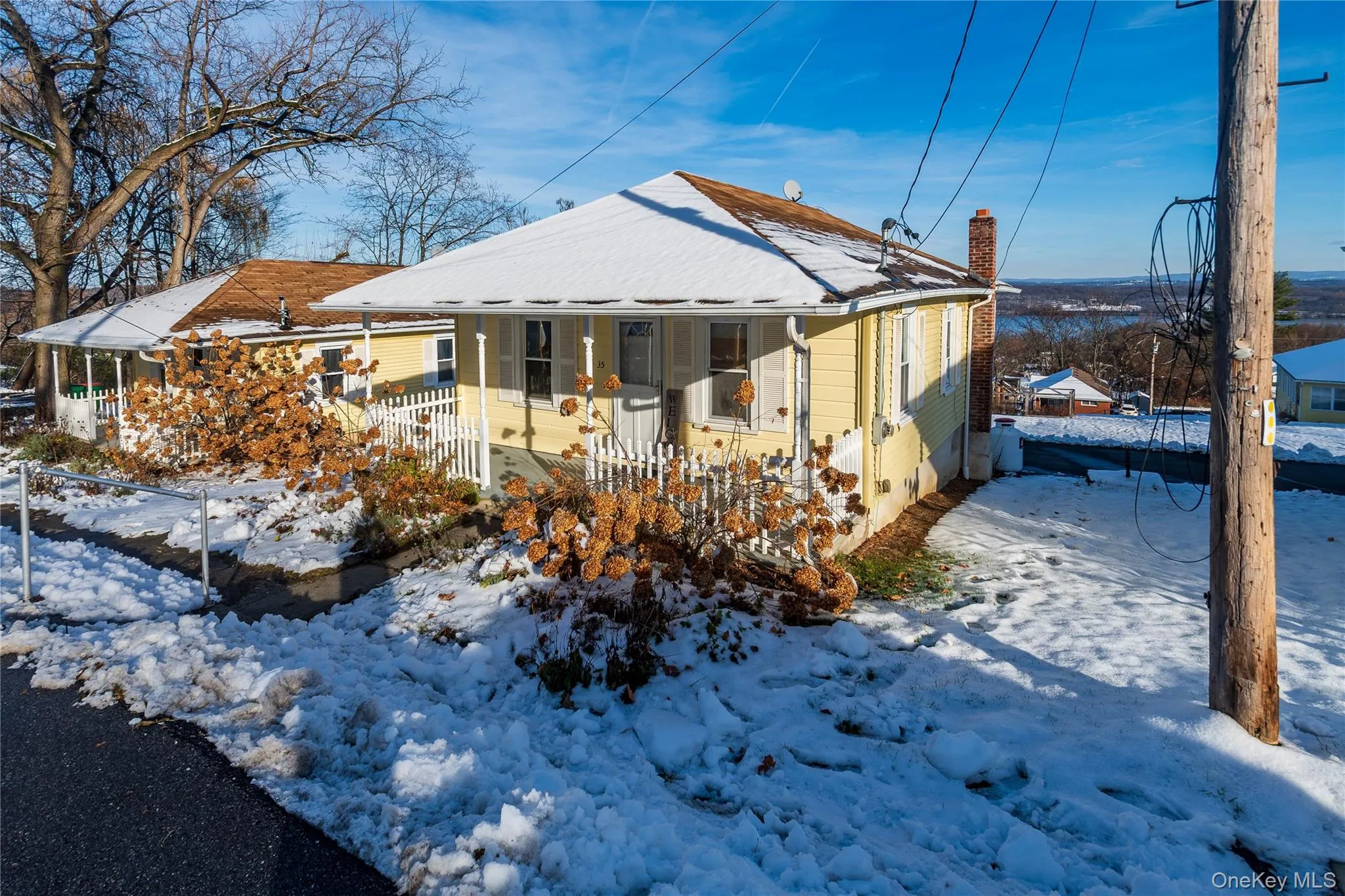 View of front of home featuring a chimney View of front of home featuring a chimney