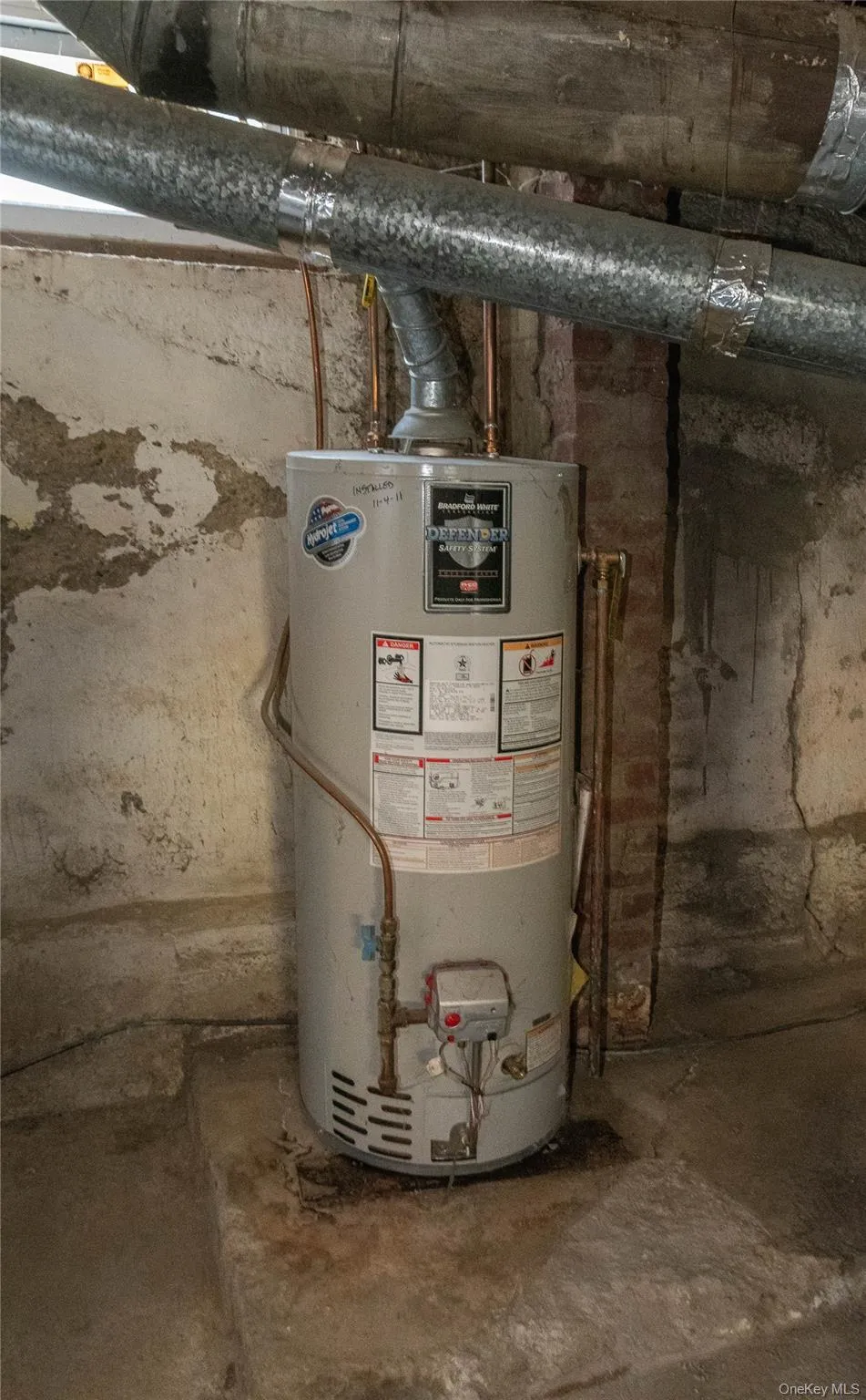 Utility room featuring water heater Utility room featuring water heater