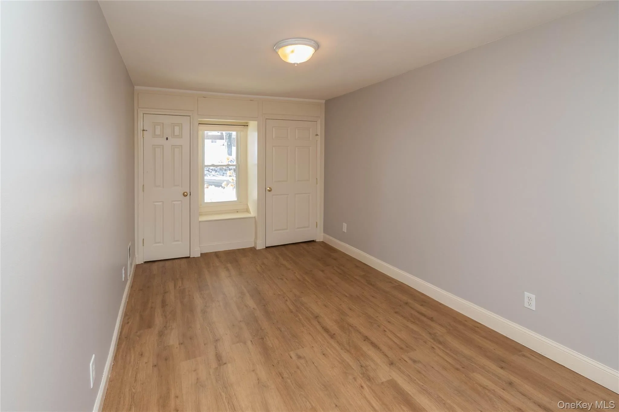 Foyer with light wood finished floors and baseboards Foyer with light wood finished floors and baseboards
