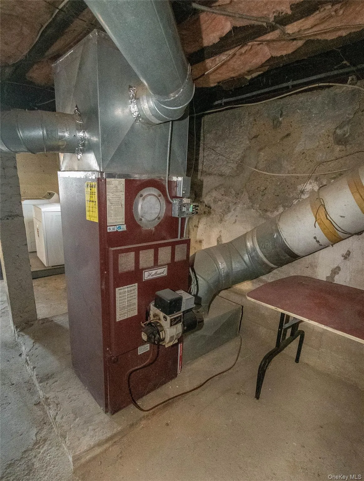 Utilities featuring washer / dryer and heating unit Utilities featuring washer / dryer and heating unit