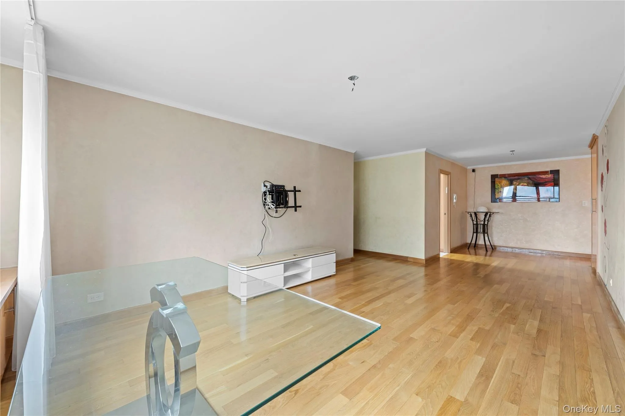 Unfurnished office with light wood-type flooring and ornamental molding Unfurnished office with light wood-type flooring and ornamental molding