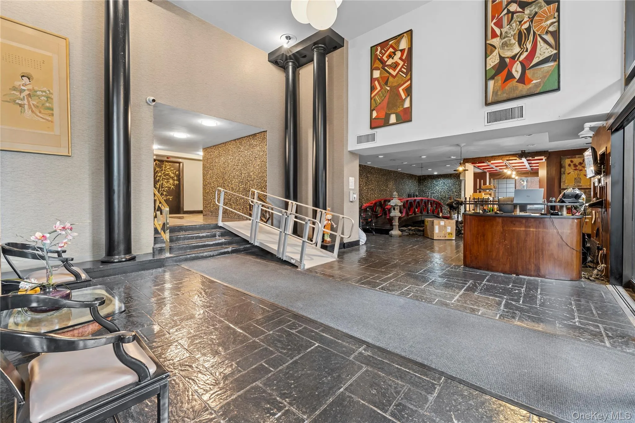 Welcome area with a towering ceiling and stairway Welcome area with a towering ceiling and stairway