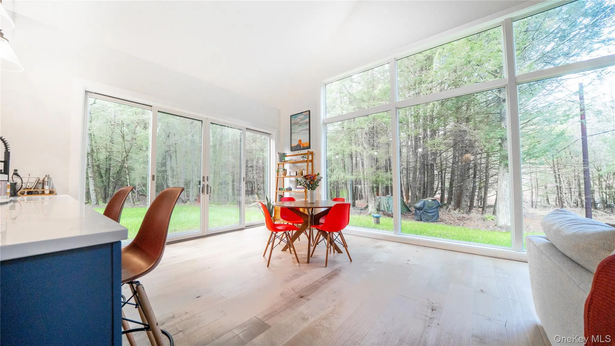 Sunroom / solarium with hardwood / wood-style flooring Sunroom / solarium with hardwood / wood-style flooring