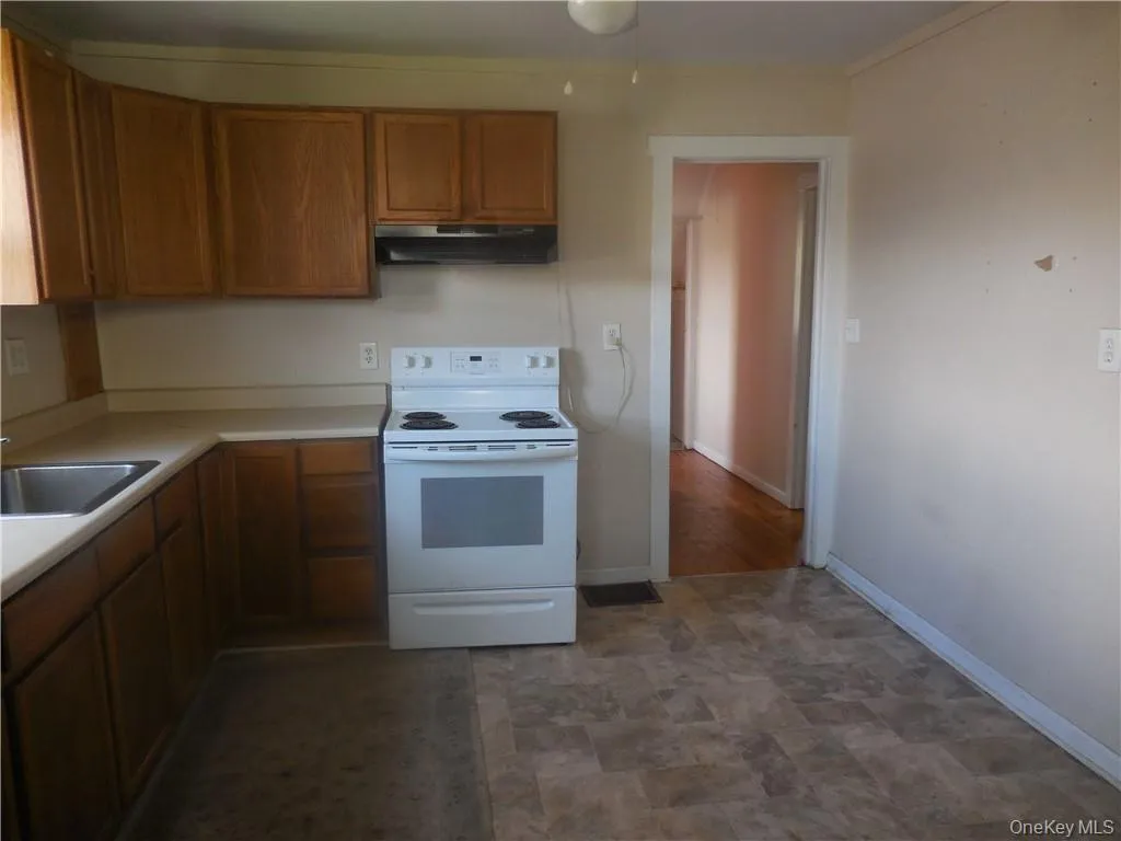 Kitchen with hall access to the rest of the apartment. Kitchen with hall access to the rest of the apartment.